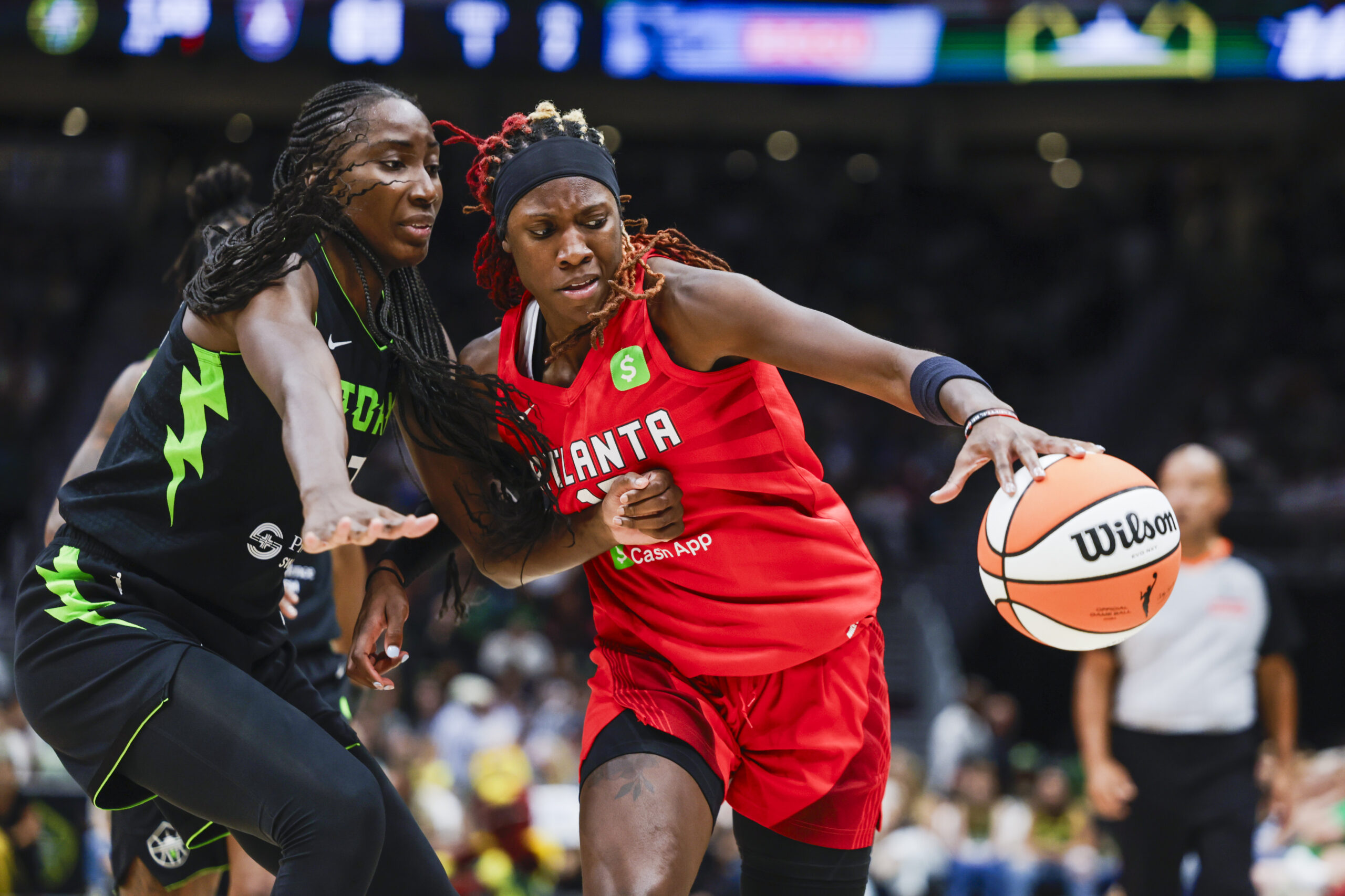 Aug 13, 2025; Seattle, Washington, USA; Atlanta Dream guard Rhyne Howard (10) dribbles against Seattle Storm forward Ezi Magbegor (13) during the fourth quarter at Climate Pledge Arena. Mandatory Credit: Joe Nicholson-Imagn Images