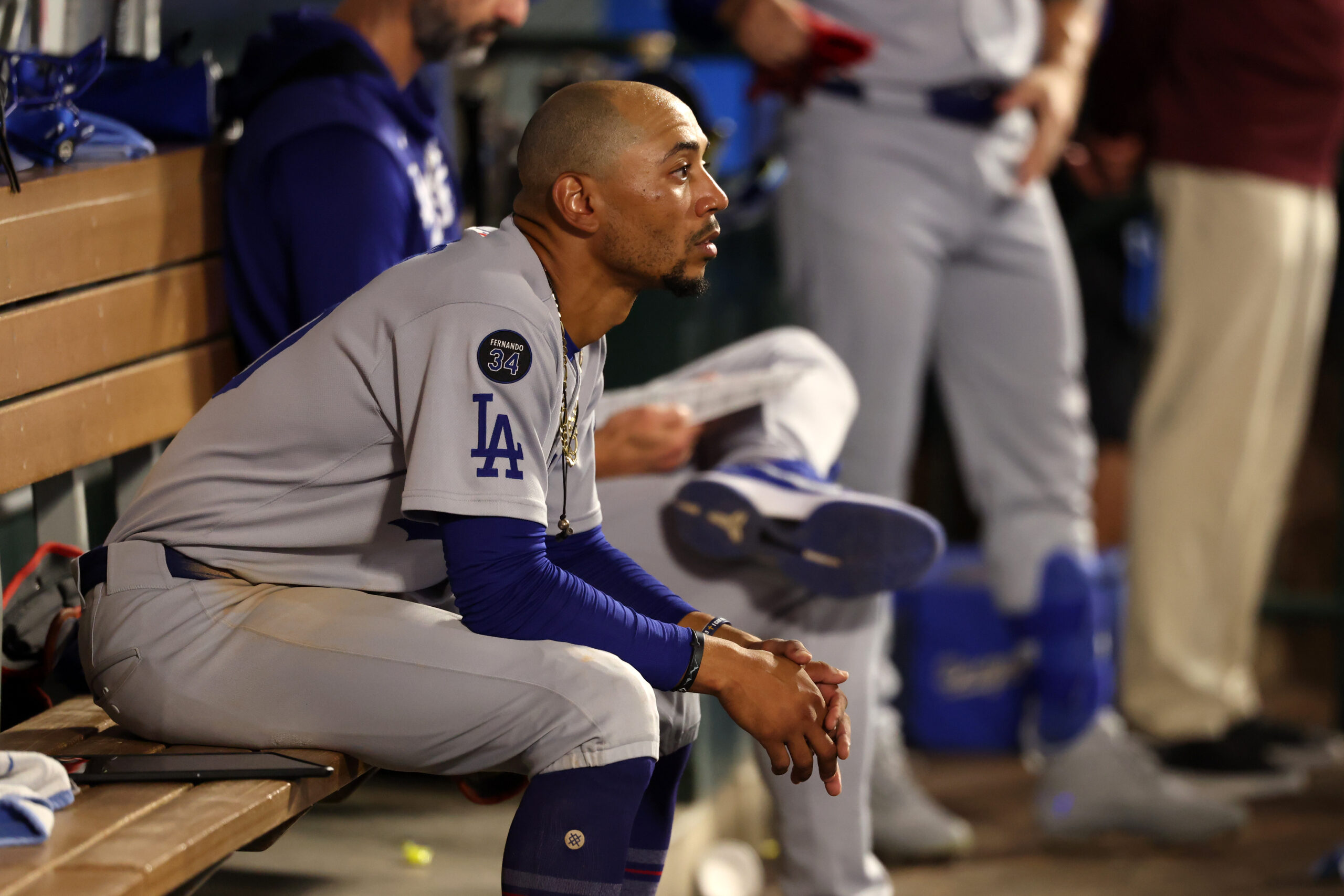 Aug 13, 2025; Anaheim, California, USA;  Los Angeles Dodgers shortstop Mookie Betts (50) looks on in the dugout during the ninth inning against the Los Angeles Angels at Angel Stadium. Mandatory Credit: Kiyoshi Mio-Imagn Images