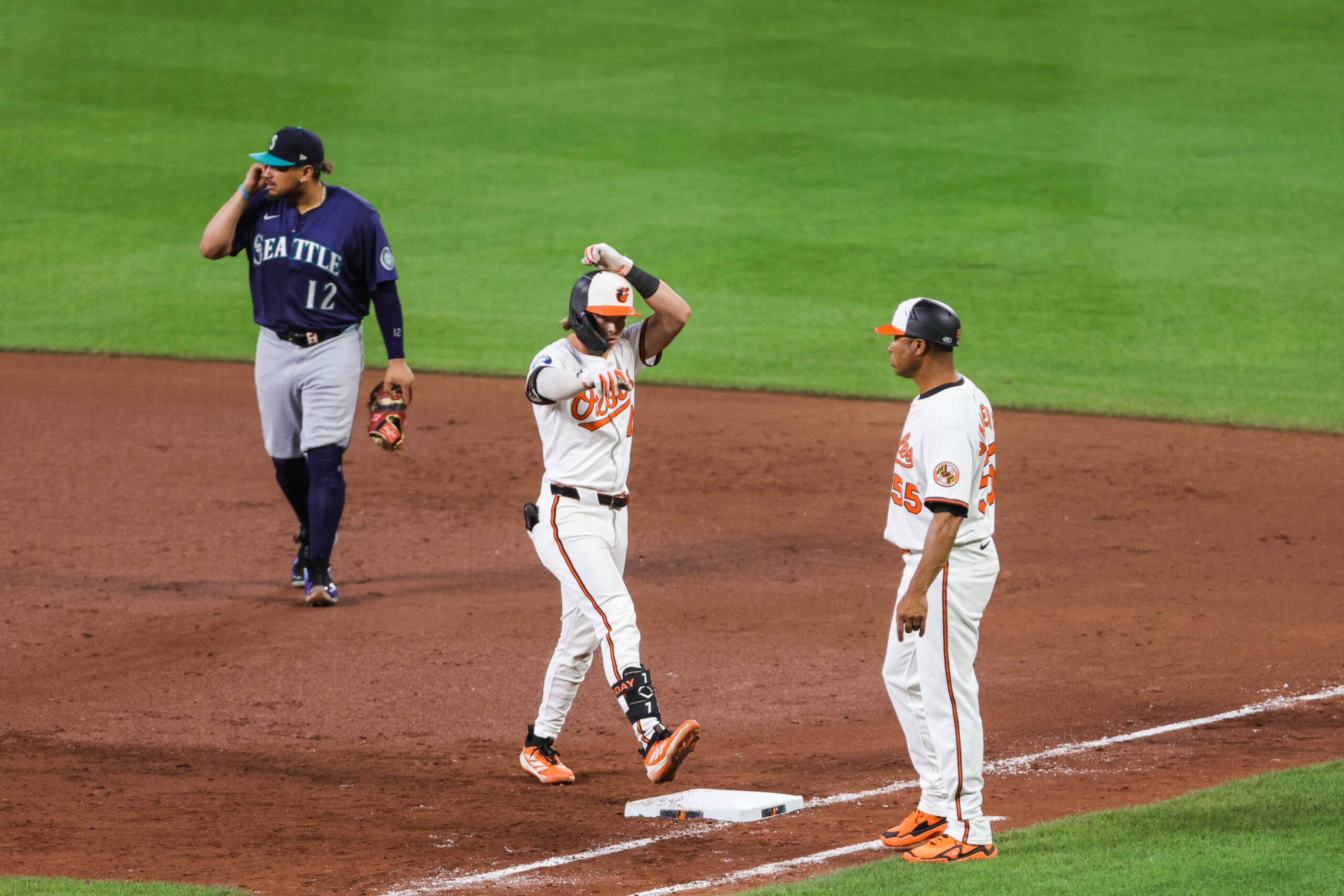 Aug 12, 2025; Baltimore, Maryland, USA; Baltimore Orioles second baseman Jackson Holliday (7) celebrates a base hit on first base in the sixth inning against the Seattle Mariners at Oriole Park at Camden Yards. Mandatory Credit: Lexi Thompson-Imagn Images