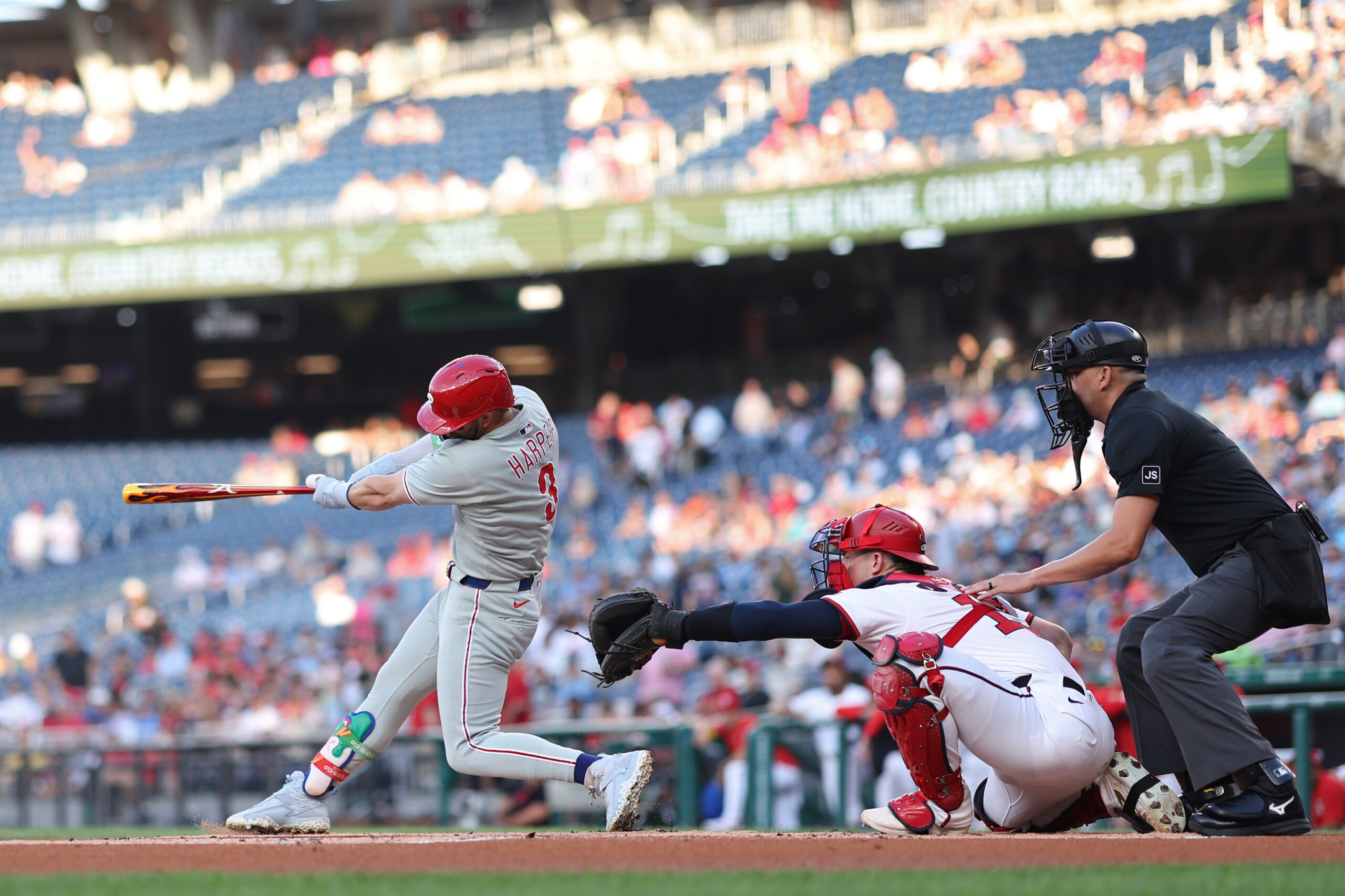 Aug 14, 2025; Washington, District of Columbia, USA; Philadelphia Phillies first baseman Bryce Harper (3) singles against the Washington Nationals during the first inning at Nationals Park. Mandatory Credit: Geoff Burke-Imagn Images