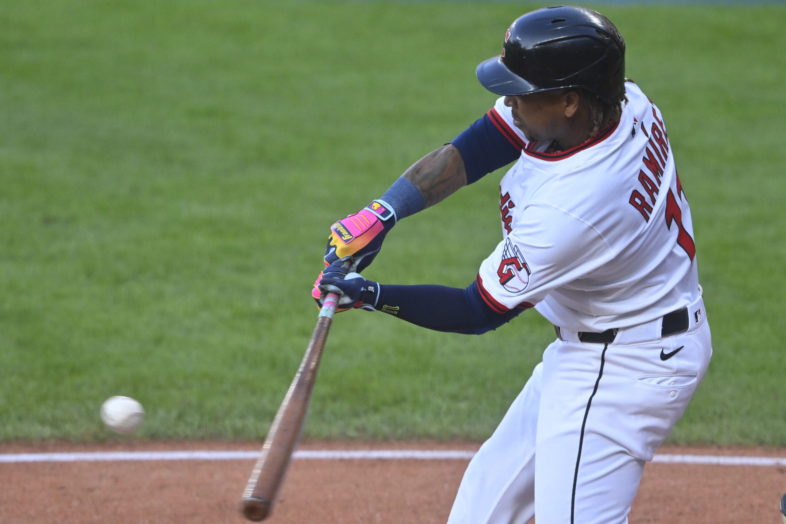 Aug 14, 2025; Cleveland, Ohio, USA; Cleveland Guardians third baseman Jose Ramirez (11) hits an RBI single in the first inning against the Miami Marlins at Progressive Field. Mandatory Credit: David Richard-Imagn Images