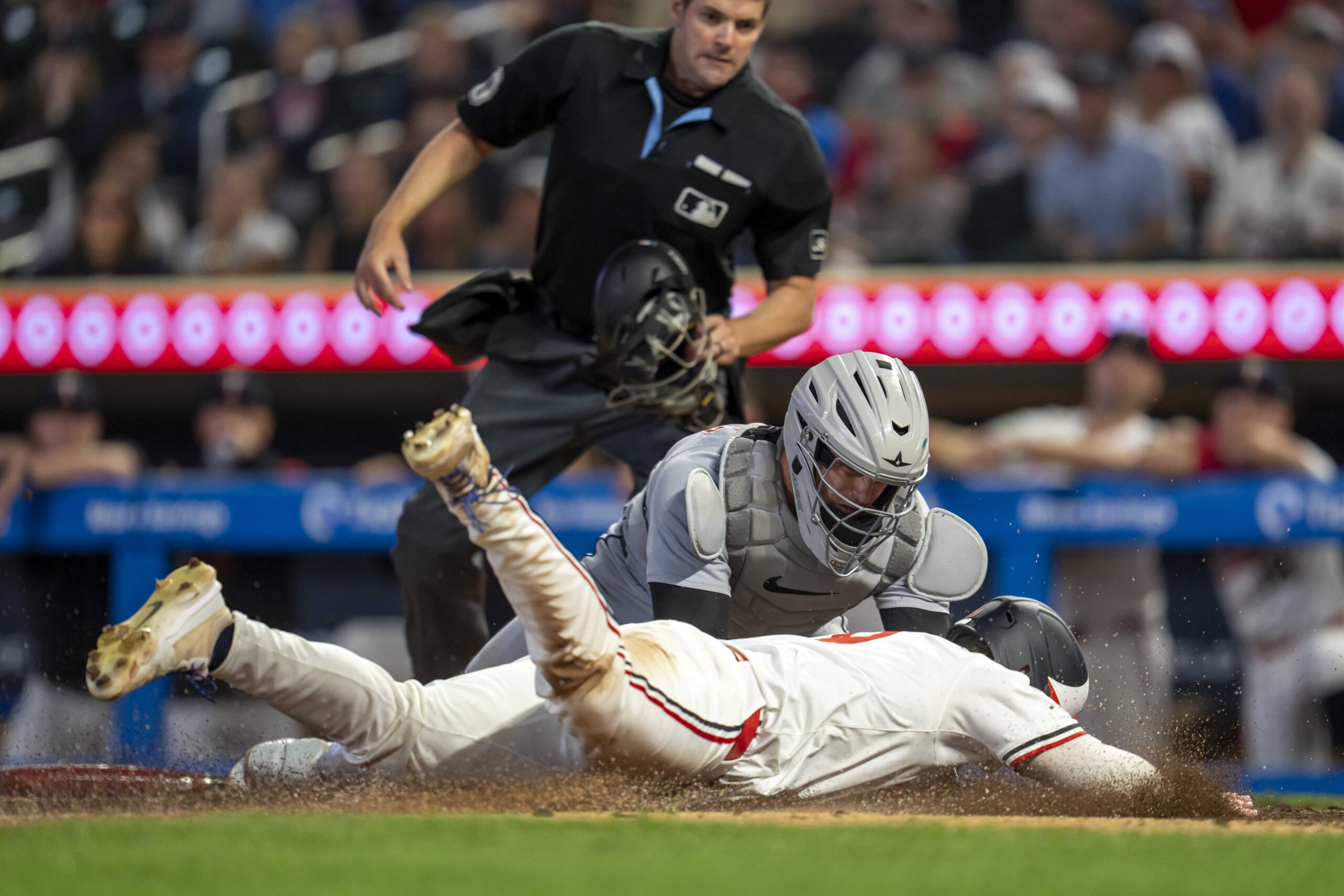 Aug 14, 2025; Minneapolis, Minnesota, USA; Detroit Tigers catcher Dillon Dingler (13) tags out Minnesota Twins left fielder Alan Roden (19) at home plate in the tenth inning at Target Field. Mandatory Credit: Jesse Johnson-Imagn Images