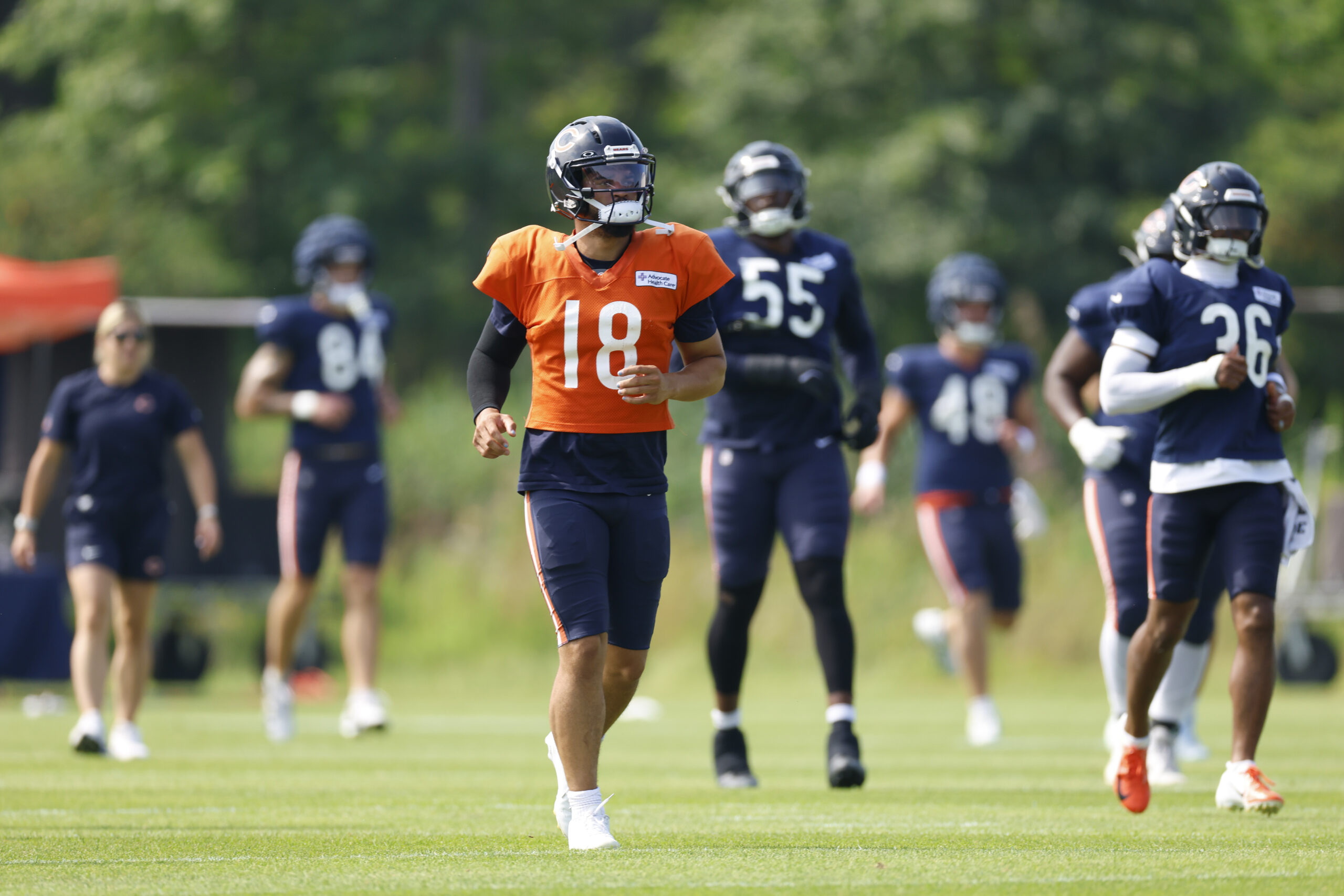 Aug 15, 2025; Lake Forest, IL, USA; Chicago Bears quarterback Caleb Williams (18) warms up with teammates during joint training camp practice with the Buffalo Bills ahead of Sunday's preseason game. Mandatory Credit: Kamil Krzaczynski-Imagn Images