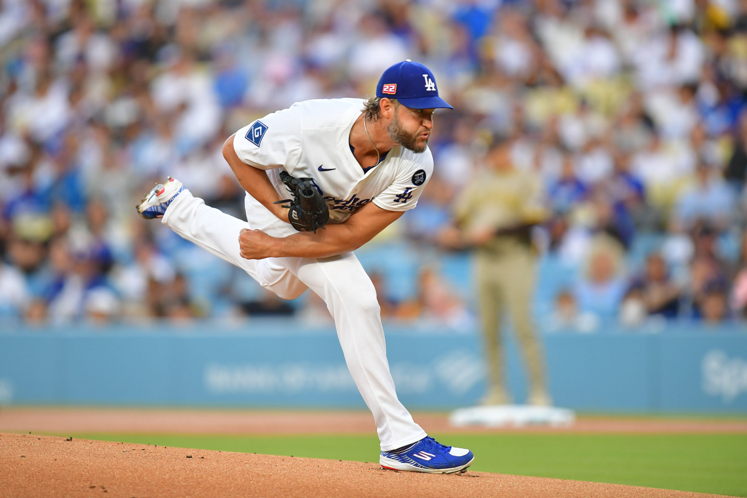 Aug 15, 2025; Los Angeles, California, USA; Los Angeles Dodgers pitcher Clayton Kershaw (22) throws against the San Diego Padres during the first inning at Dodger Stadium. Mandatory Credit: Gary A. Vasquez-Imagn Images