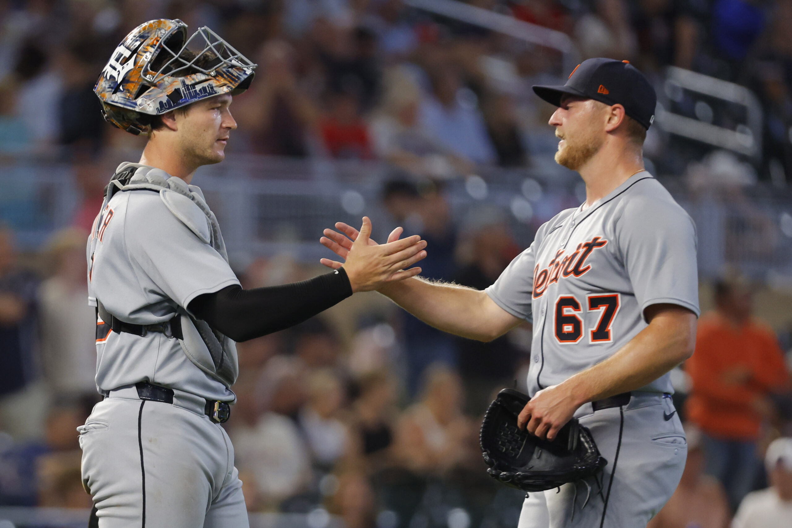 Aug 15, 2025; Minneapolis, Minnesota, USA; Detroit Tigers catcher Dillon Dingler (13) and relief pitcher Bailey Horn (67) celebrate the win over the Minnesota Twins at Target Field. Mandatory Credit: Bruce Kluckhohn-Imagn Images