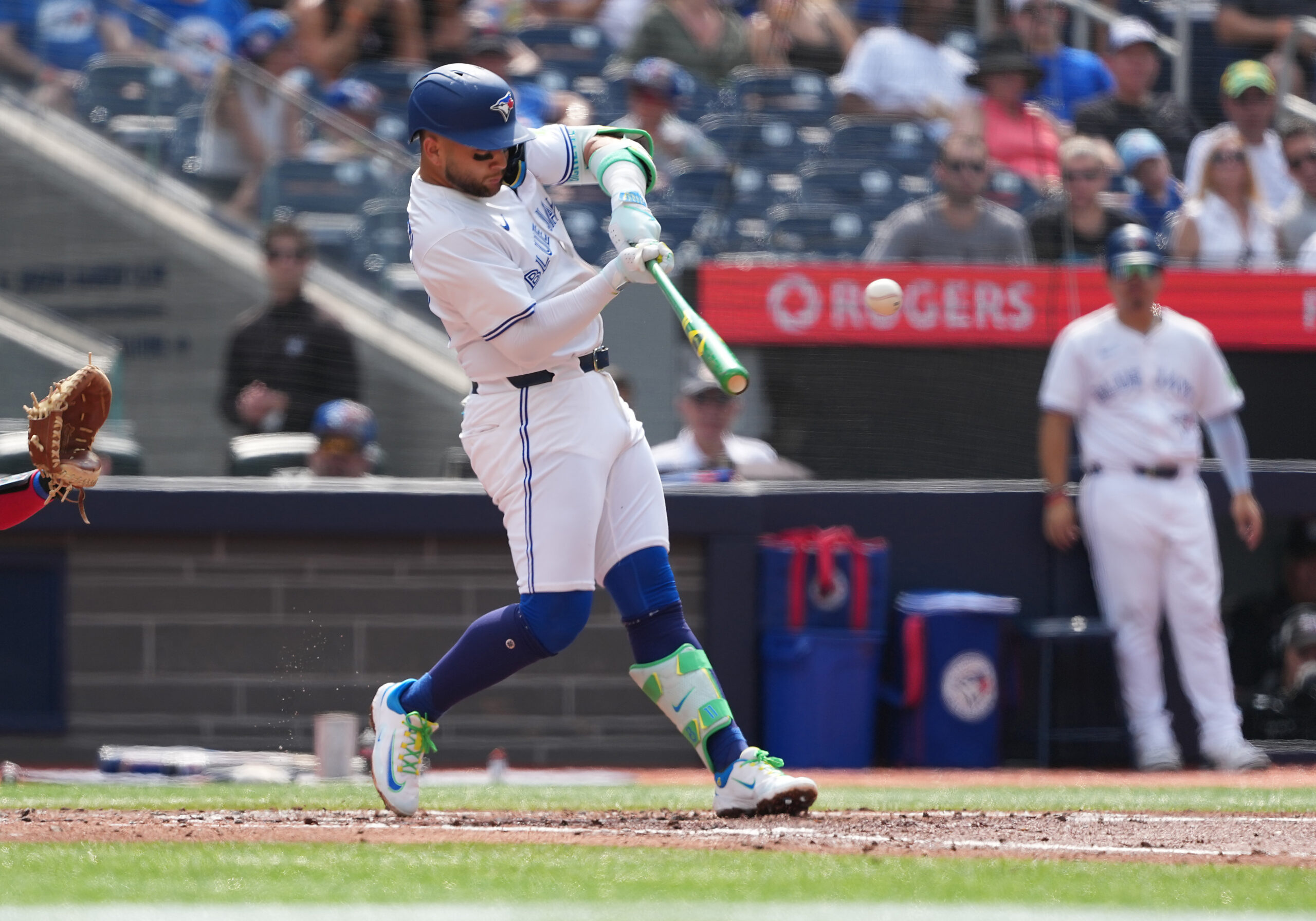 Aug 16, 2025; Toronto, Ontario, CAN; Toronto Blue Jays shortstop Bo Bichette (11) hits a single against the Texas Rangers during the the second inning at Rogers Centre. Credit: Nick Turchiaro-Imagn Images