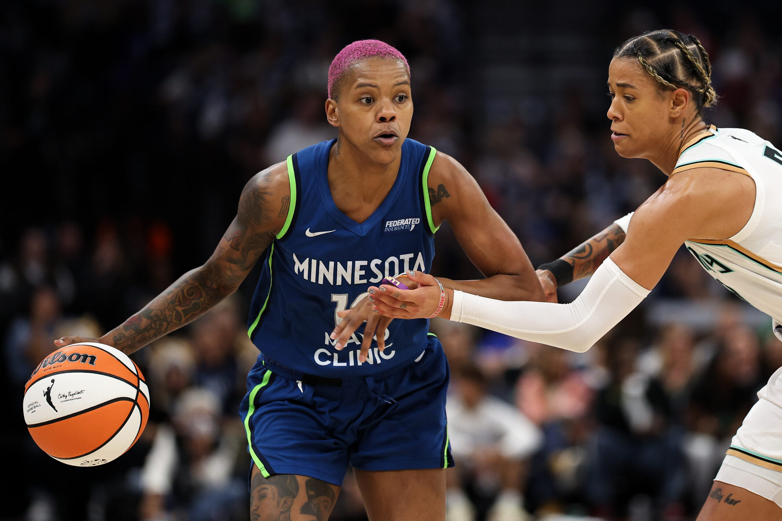 Aug 16, 2025; Minneapolis, Minnesota, USA; Minnesota Lynx guard Courtney Williams (10) works around New York Liberty guard Natasha Cloud (9) during the third quarter at Target Center. Mandatory Credit: Matt Krohn-Imagn Images