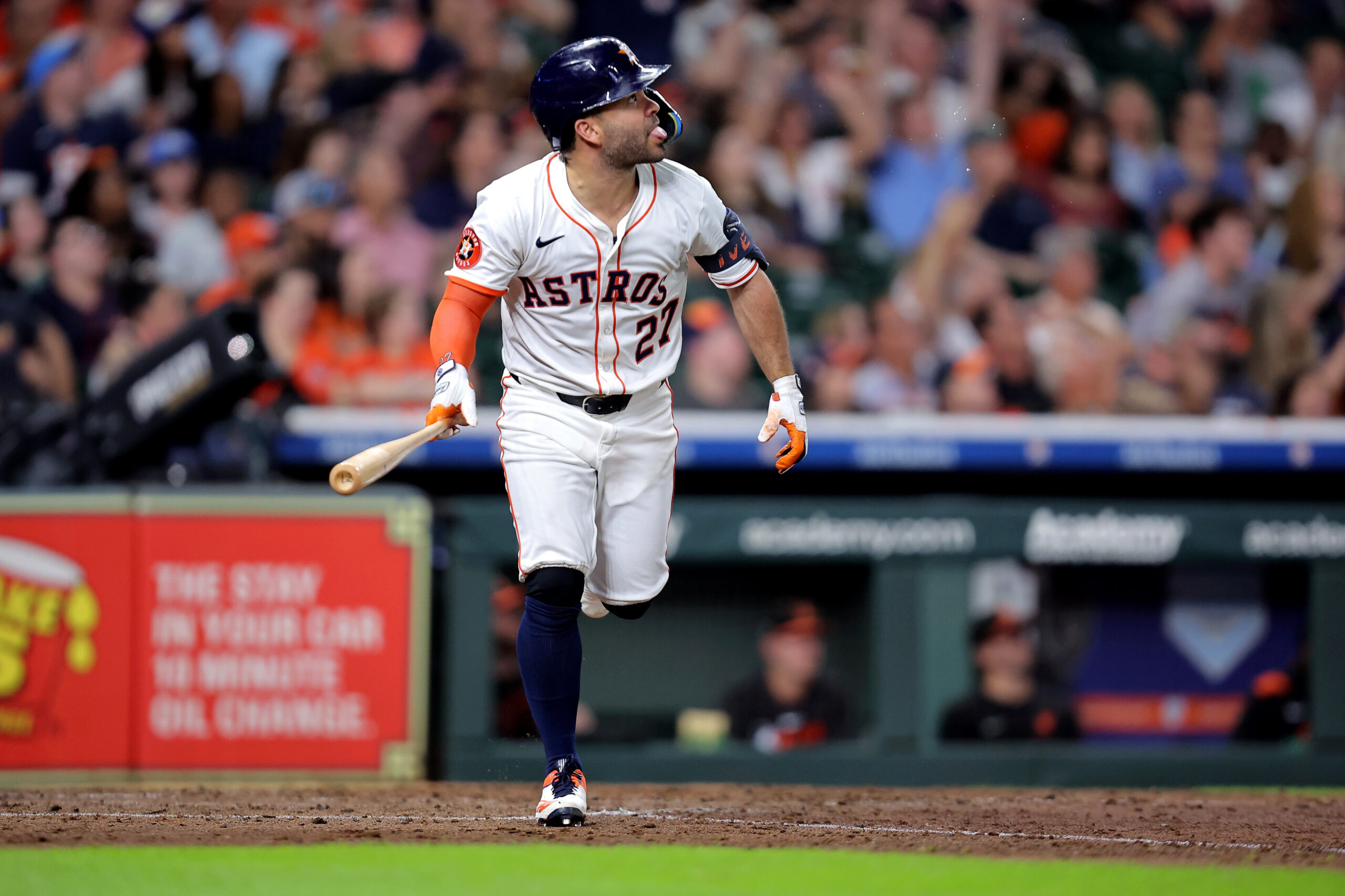 Aug 16, 2025; Houston, Texas, USA; Houston Astros designated hitter Jose Altuve (27) hits a home run to center field against the Baltimore Orioles during the seventh inning at Daikin Park. Mandatory Credit: Erik Williams-Imagn Images