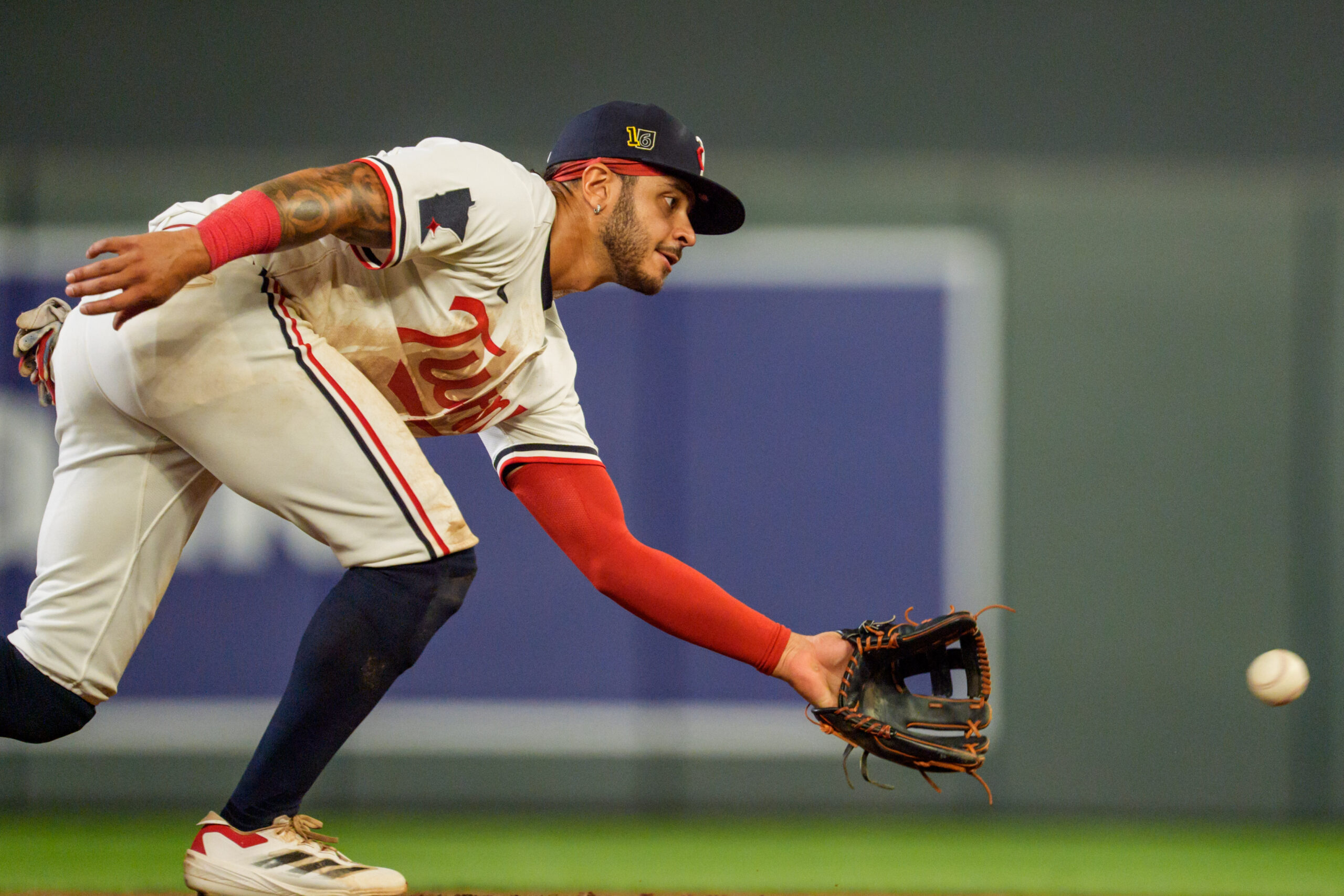 Aug 16, 2025; Minneapolis, Minnesota, USA; Minnesota Twins second baseman Austin Martin (16) fields a throw to second base during the warmups at the top of the eighth inning against the Detroit Tigers at Target Field. Mandatory Credit: Matt Blewett-Imagn Images