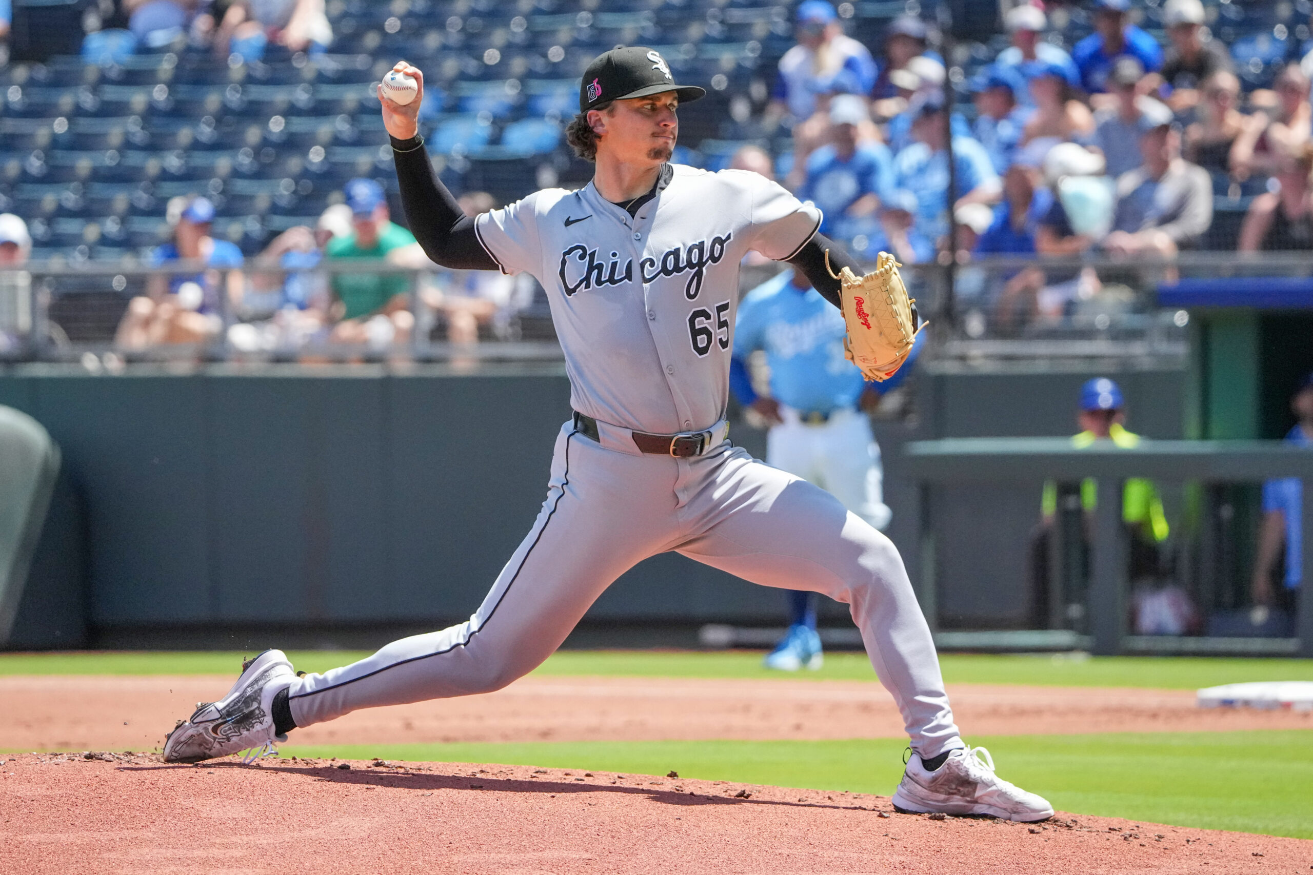 Aug 17, 2025; Kansas City, Missouri, USA; Chicago White Sox starting pitcher Davis Martin (65) delivers a pitch against the Kansas City Royals during the first inning at Kauffman Stadium. Mandatory Credit: Denny Medley-Imagn Images
