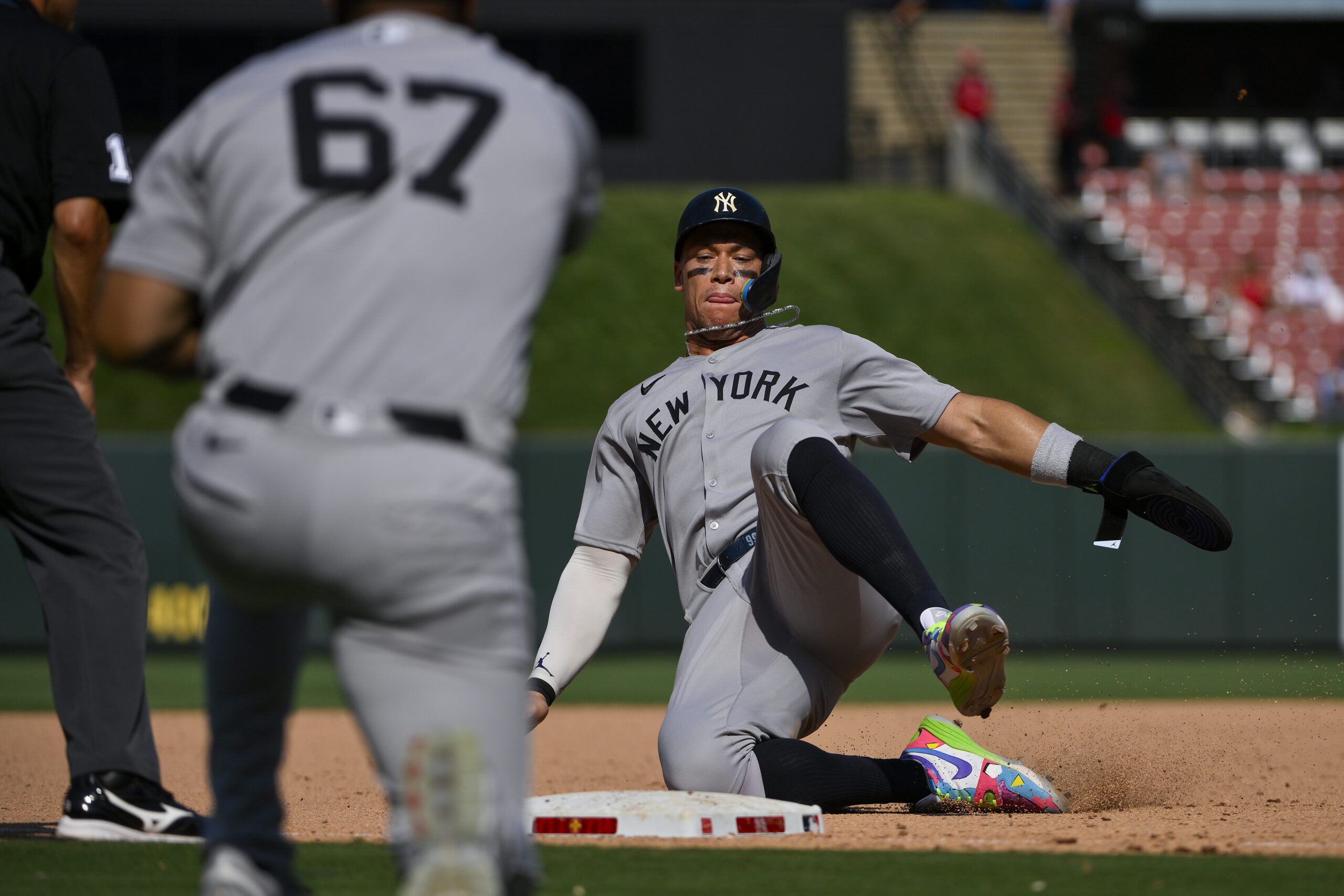 Aug 17, 2025; St. Louis, Missouri, USA; New York Yankees designated hitter Aaron Judge (99) slides in at third base against the St. Louis Cardinals during the ninth inning at Busch Stadium. Mandatory Credit: Jeff Curry-Imagn Images