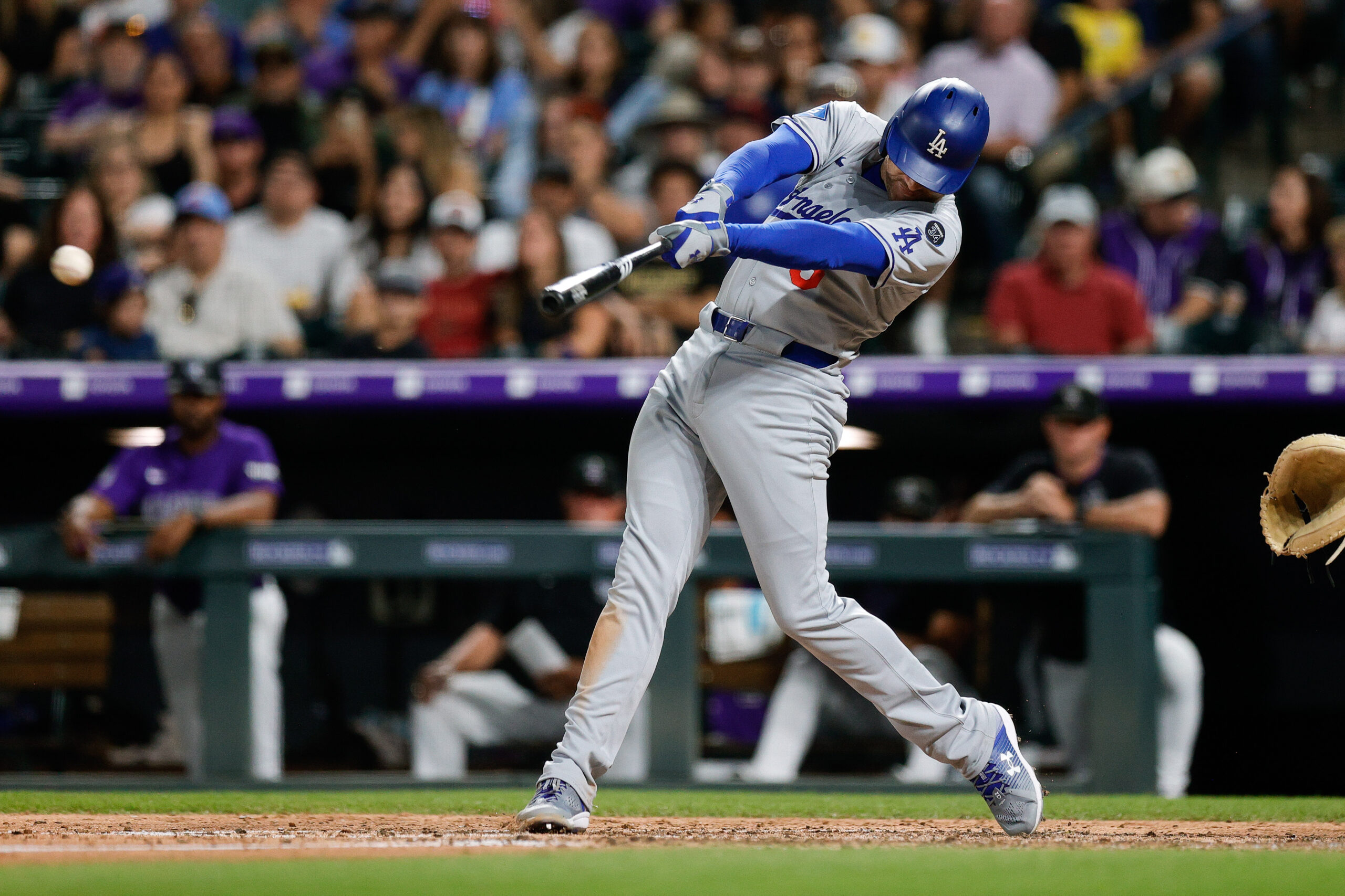 Aug 18, 2025; Denver, Colorado, USA; Los Angeles Dodgers first baseman Freddie Freeman (5) hits a double in the eighth inning against the Colorado Rockies at Coors Field. Mandatory Credit: Isaiah J. Downing-Imagn Images