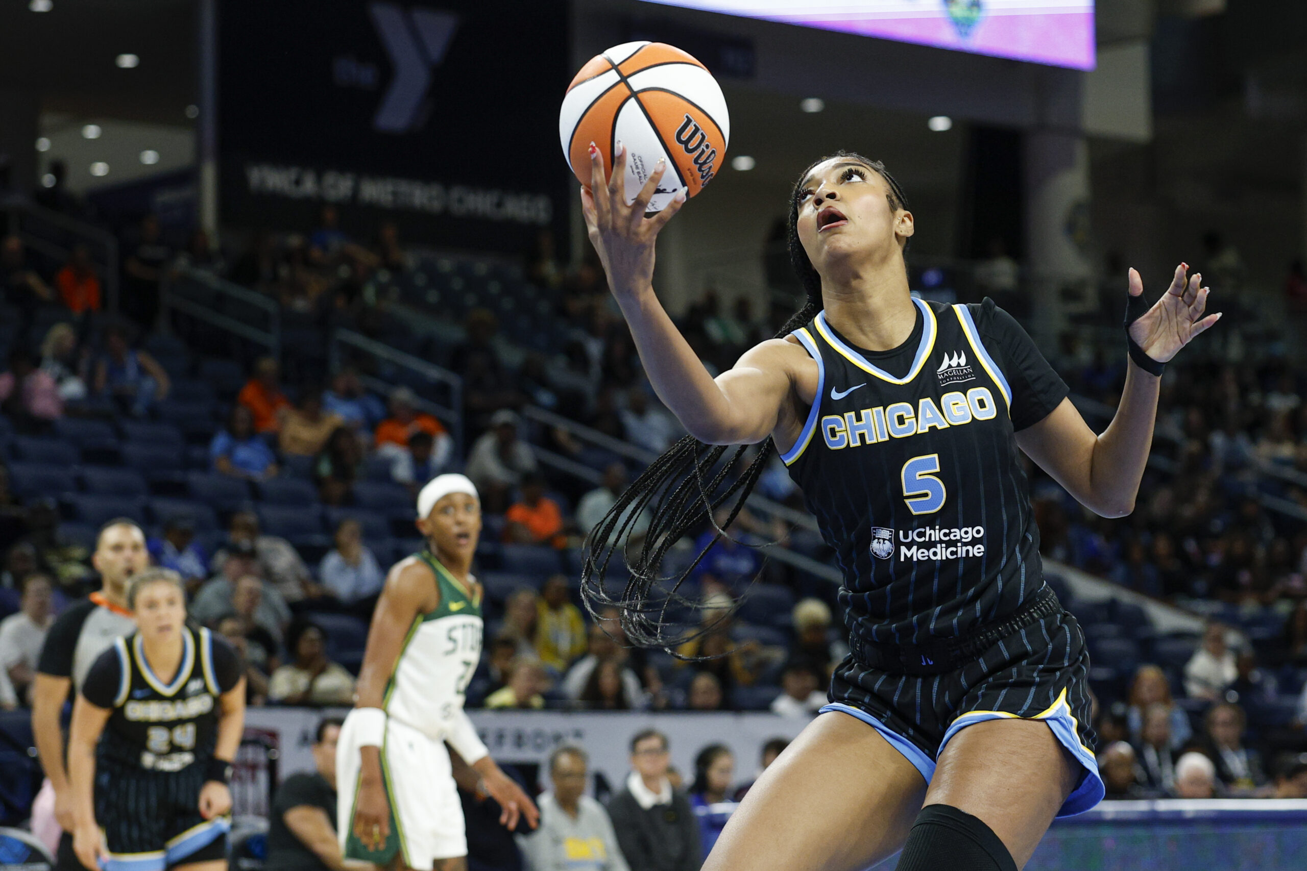 Aug 19, 2025; Chicago, Illinois, USA; Chicago Sky forward Angel Reese (5) drives to the basket against the Seattle Storm during the first half at Wintrust Arena. Mandatory Credit: Kamil Krzaczynski-Imagn Images