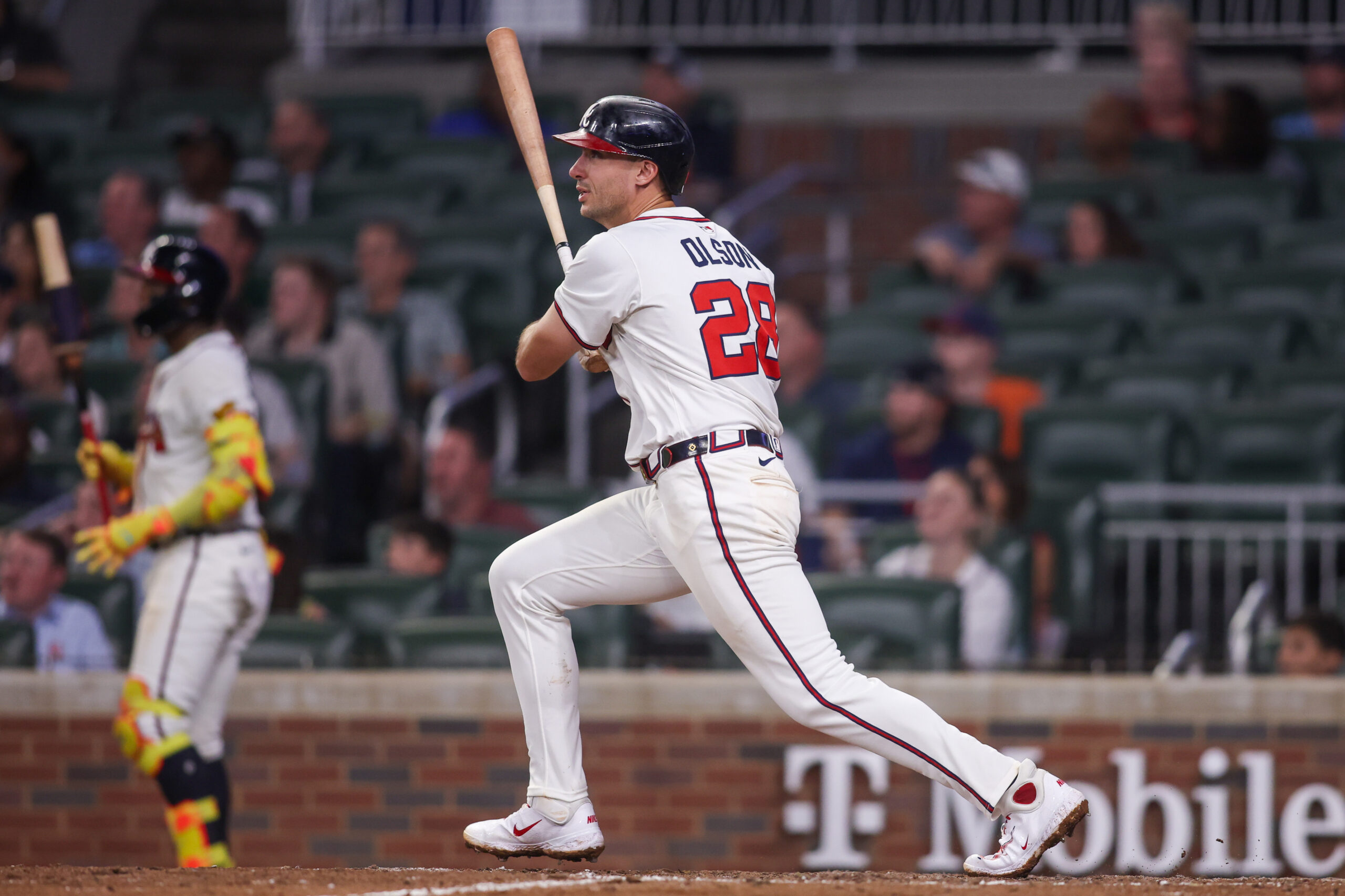 Aug 19, 2025; Atlanta, Georgia, USA; Atlanta Braves first baseman Matt Olson (28) hits a double against the Chicago White Sox in the eighth inning at Truist Park. Mandatory Credit: Brett Davis-Imagn Images