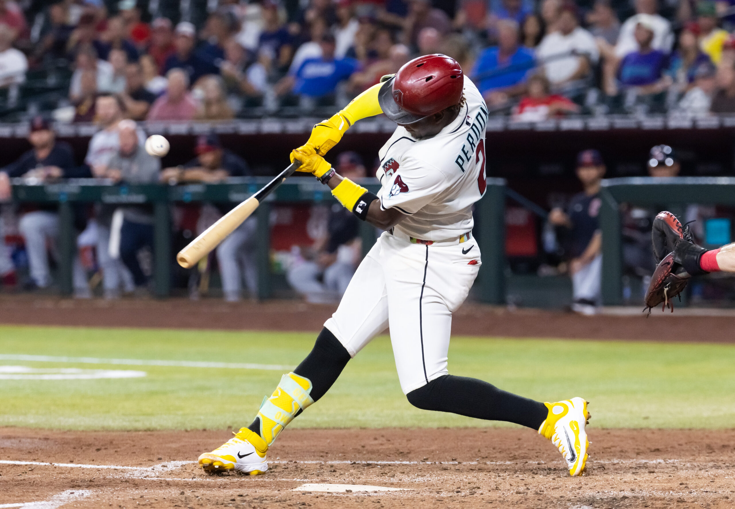 Aug 19, 2025; Phoenix, Arizona, USA; Arizona Diamondbacks infielder Geraldo Perdomo hits an RBI single in the fifth inning against the Cleveland Guardians at Chase Field. Mandatory Credit: Mark J. Rebilas-Imagn Images