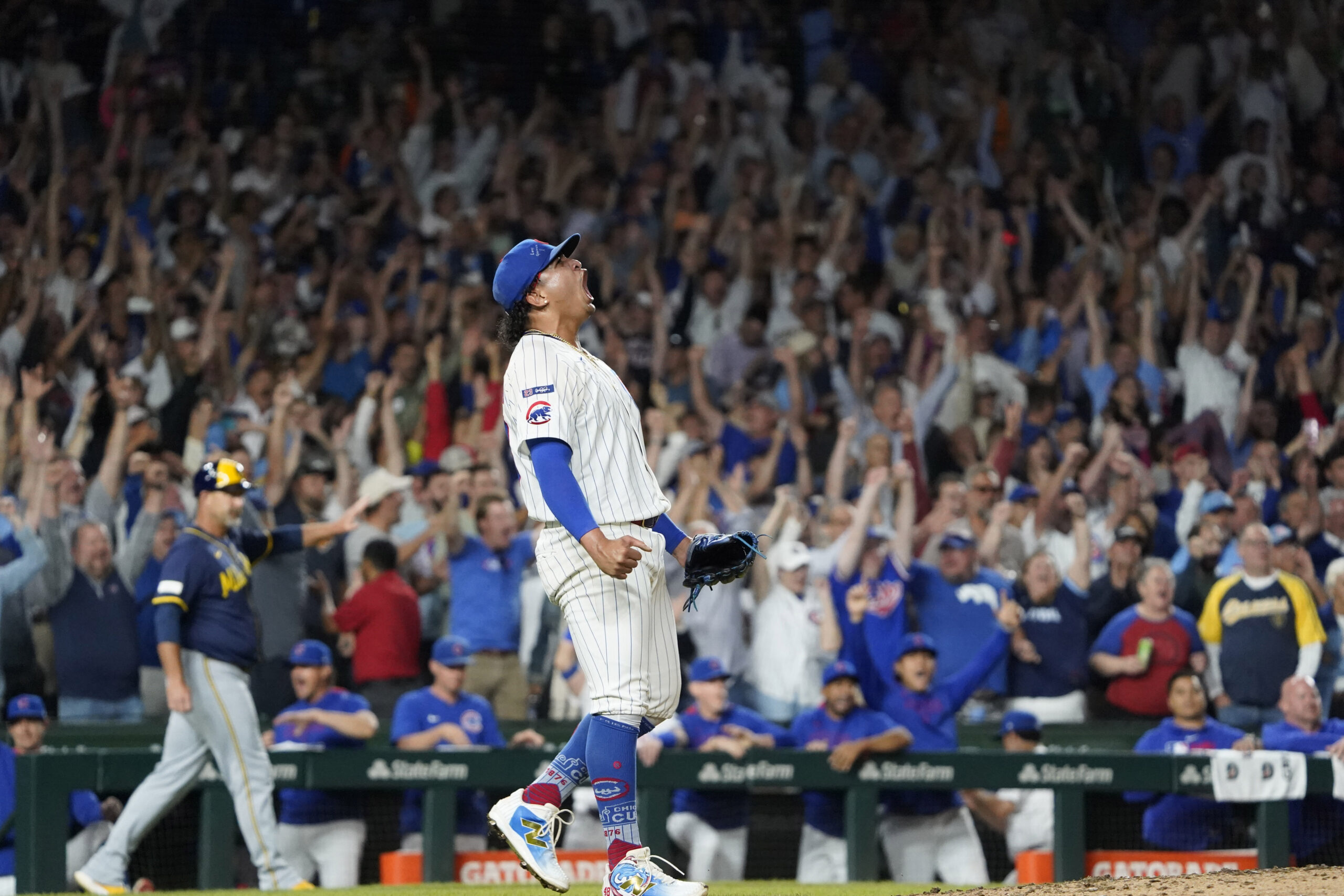 Aug 20, 2025; Chicago, Illinois, USA; Chicago Cubs pitcher Daniel Palencia (48) reacts after getting the final out against the Milwaukee Brewers during the ninth inning at Wrigley Field. Mandatory Credit: David Banks-Imagn Images