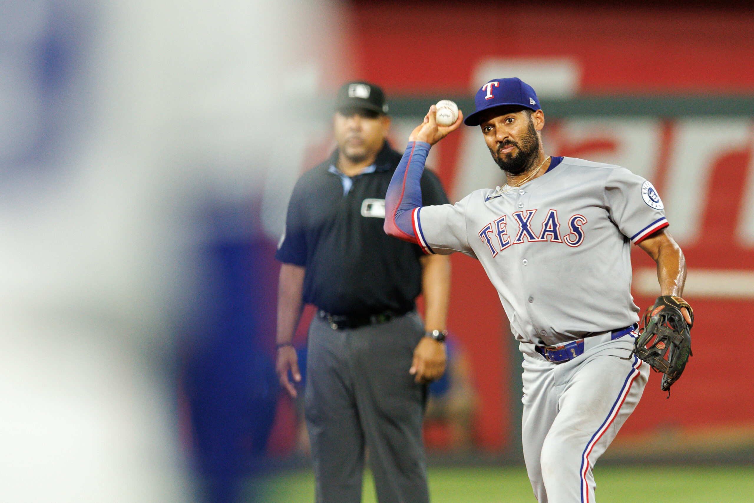 Aug 20, 2025; Kansas City, Missouri, USA; Texas Rangers second base Marcus Semien (2) throws to first base during the ninth inning against the Kansas City Royals at Kauffman Stadium. Mandatory Credit: William Purnell-Imagn Images