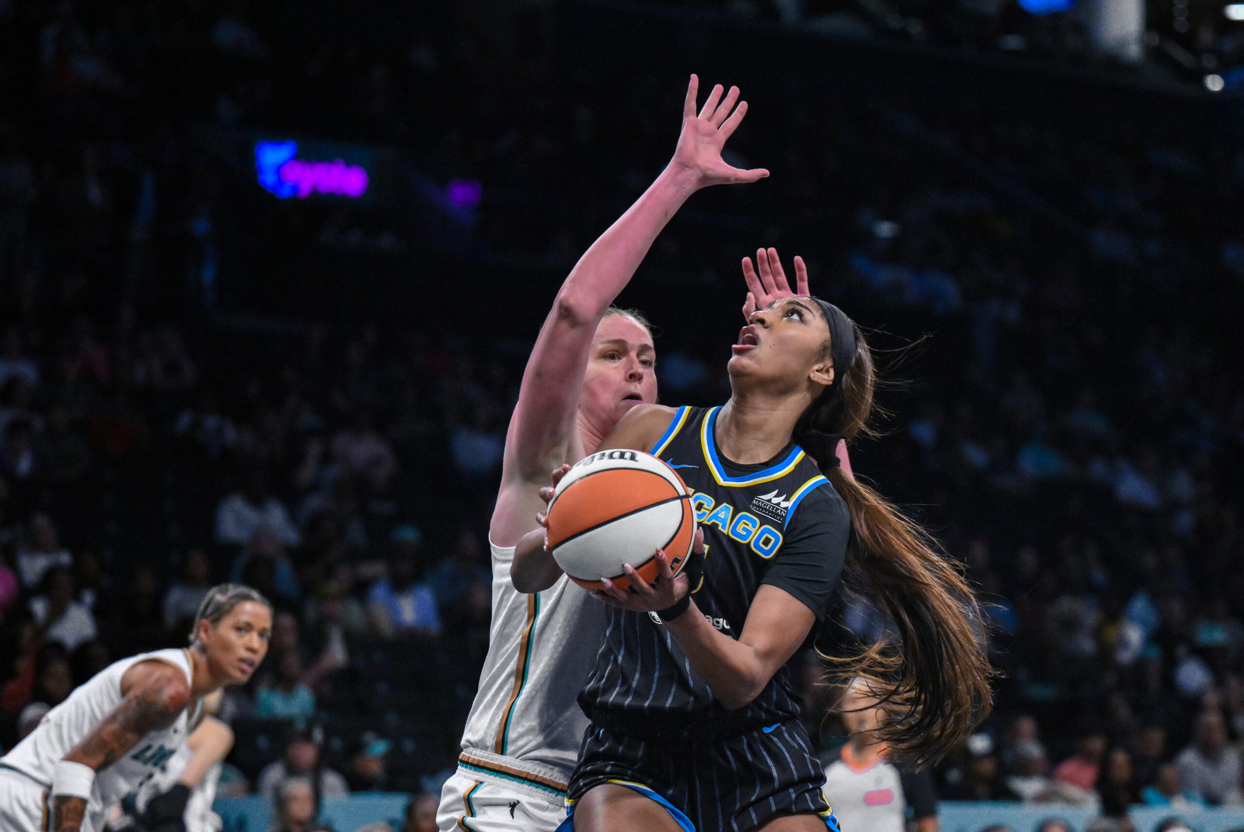 Aug 21, 2025; Brooklyn, New York, USA; Chicago Sky forward Angel Reese (5) shoots the ball while defended by New York Liberty center Emma Meesseman (33) during the first half at Barclays Center. Mandatory Credit: John Jones-Imagn Images