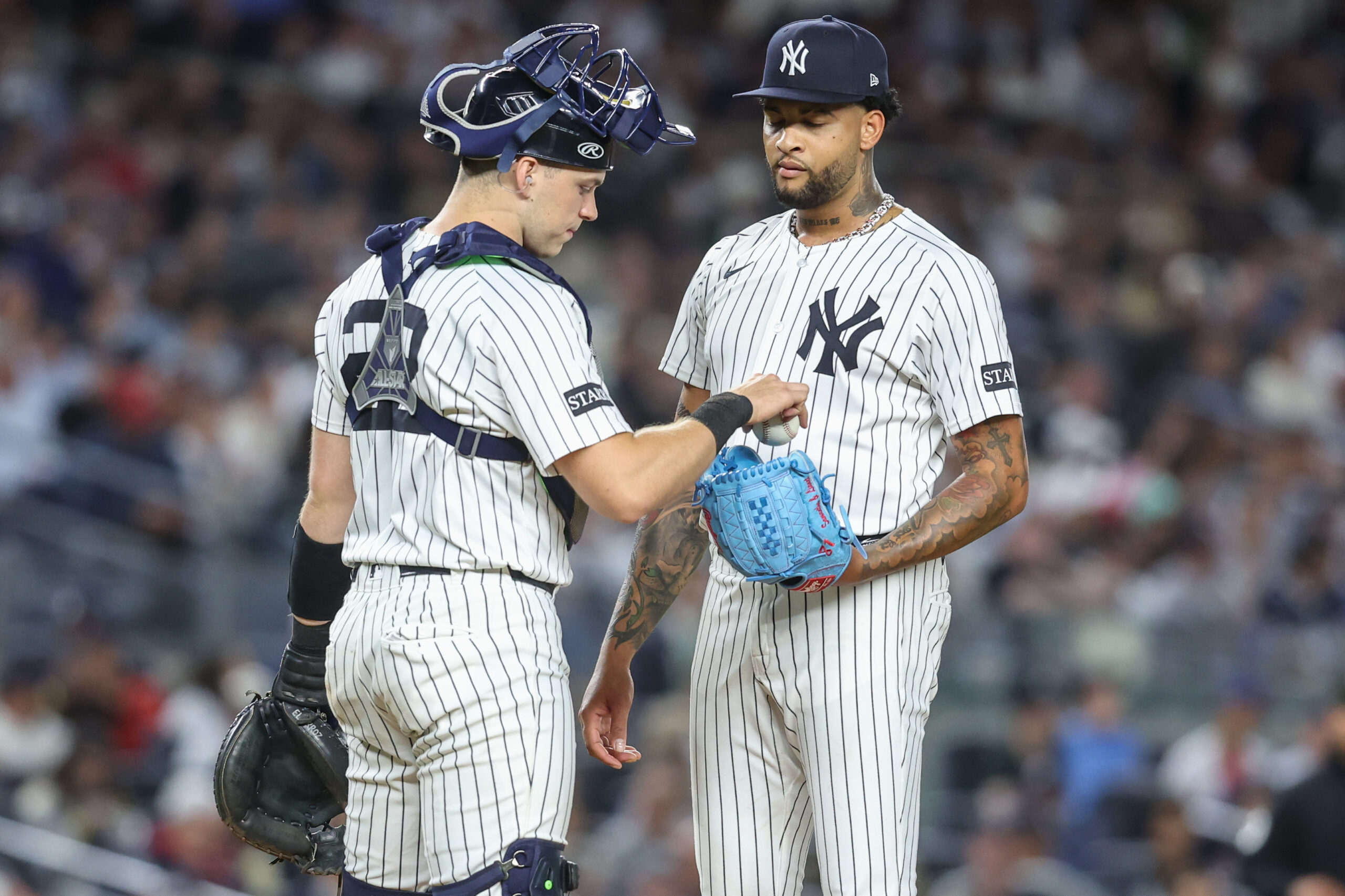 Aug 21, 2025; Bronx, New York, USA; New York Yankees starting pitcher Luis Gil (81) talks with catcher Ben Rice (22) after loading the bases in the fifth inning against the Boston Red Sox at Yankee Stadium. Mandatory Credit: Wendell Cruz-Imagn Images