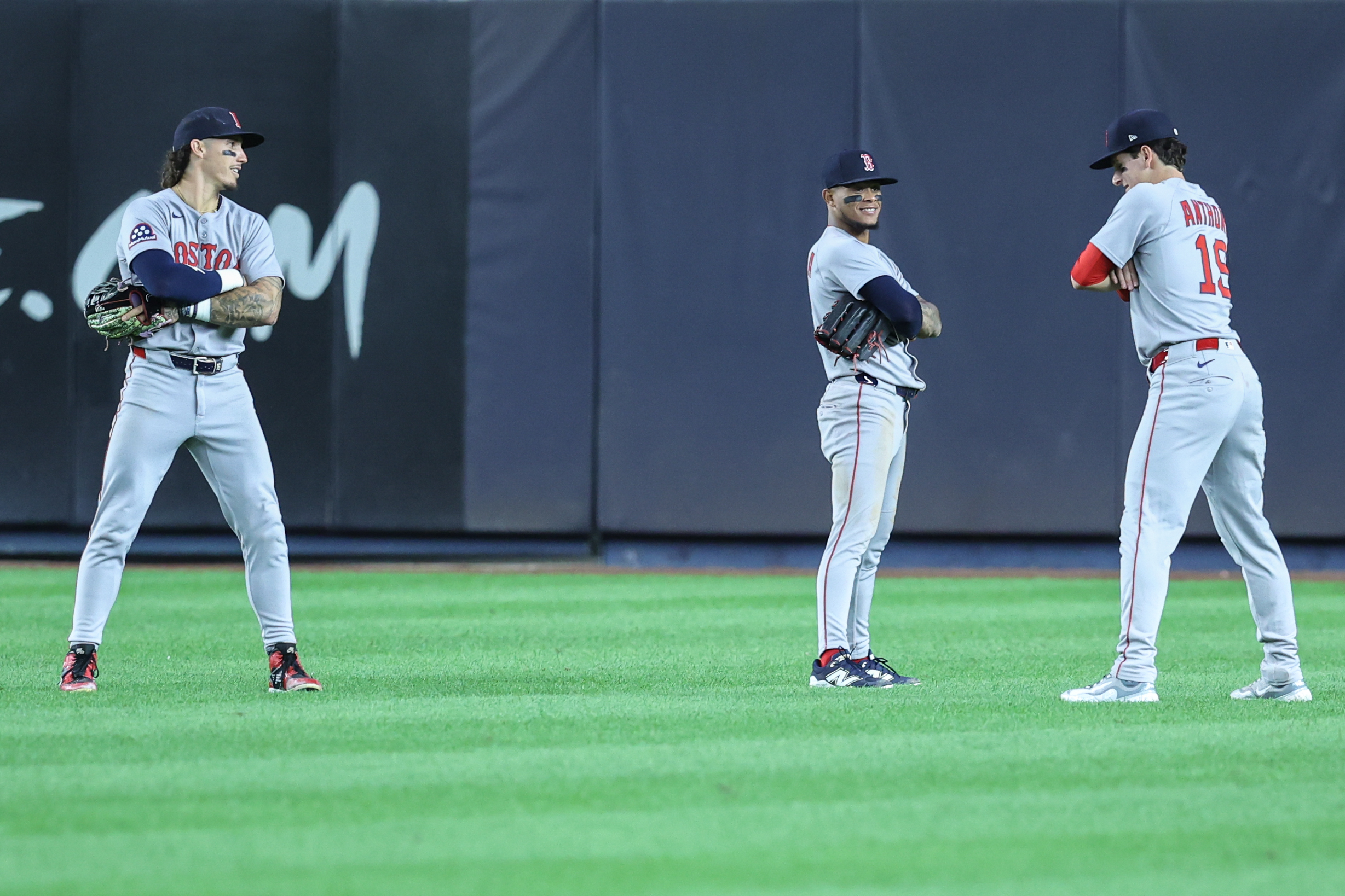 Aug 21, 2025; Bronx, New York, USA; Boston Red Sox left fielder Jarren Duran (16), center fielder Ceddanne Rafaela (3) and right fielder Roman Anthony (19) pose after defeating the New York Yankees 6-3 at Yankee Stadium. Mandatory Credit: Wendell Cruz-Imagn Images