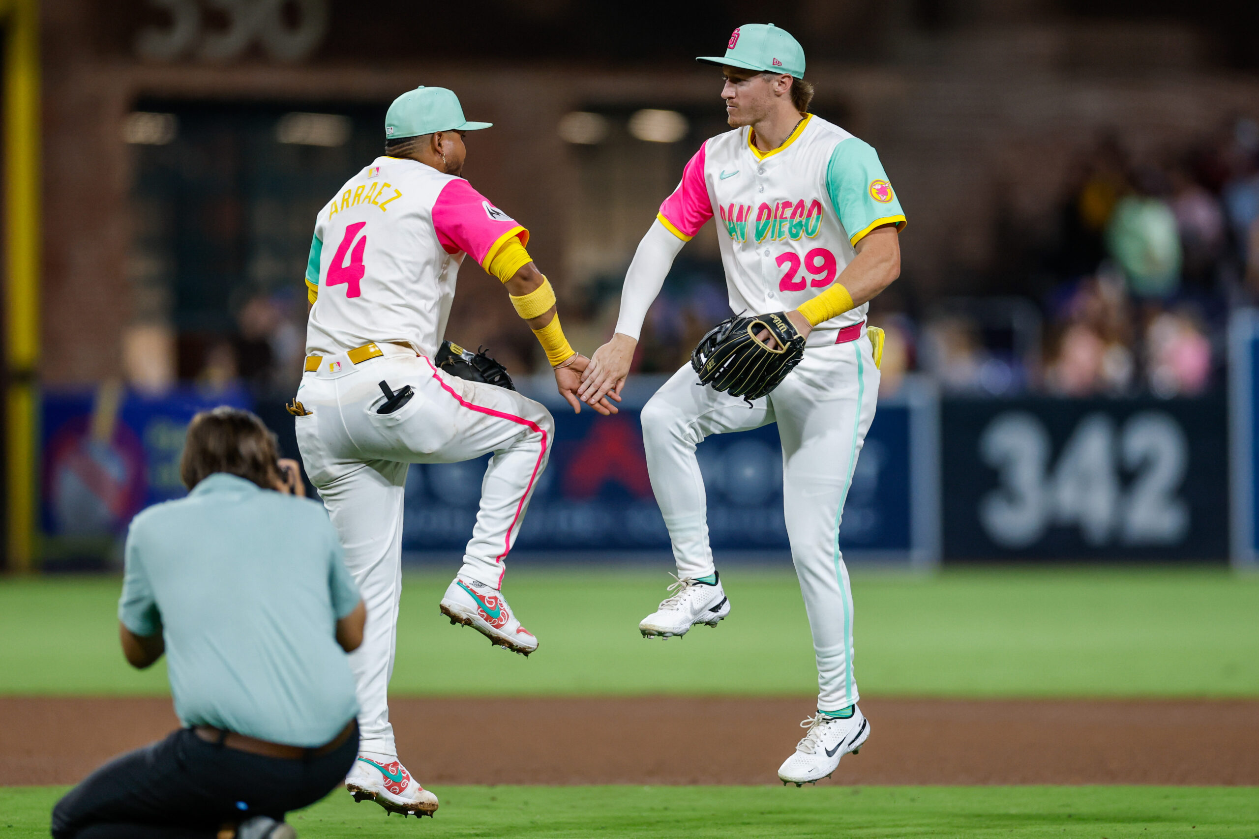Aug 22, 2025; San Diego, California, USA; San Diego Padres first baseman Luis Arraez (4) celebrates with center fielder Bryce Johnson (29) after defeating the the Los Angeles Dodgers at Petco Park. Mandatory Credit: David Frerker-Imagn Images