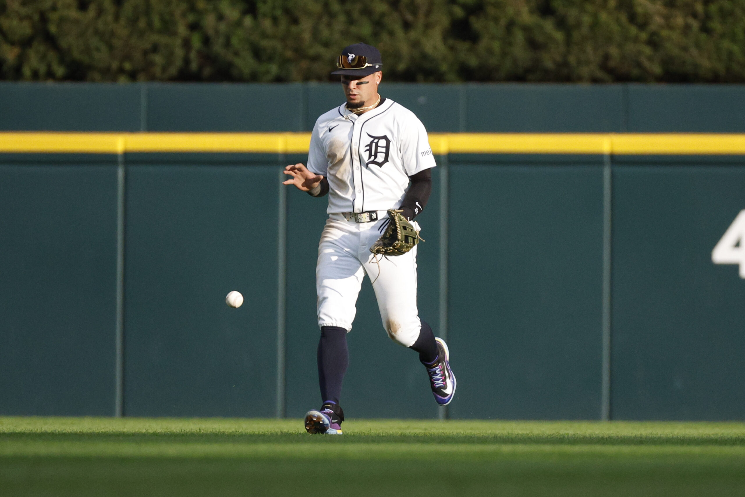 Aug 23, 2025; Detroit, Michigan, USA; Detroit Tigers outfielder Javier Báez (28) retrieves a ground ball hit by Kansas City Royals shortstop Bobby Witt Jr. (7) during the fifth inning at Comerica Park. Mandatory Credit: Brian Bradshaw Sevald-Imagn Images