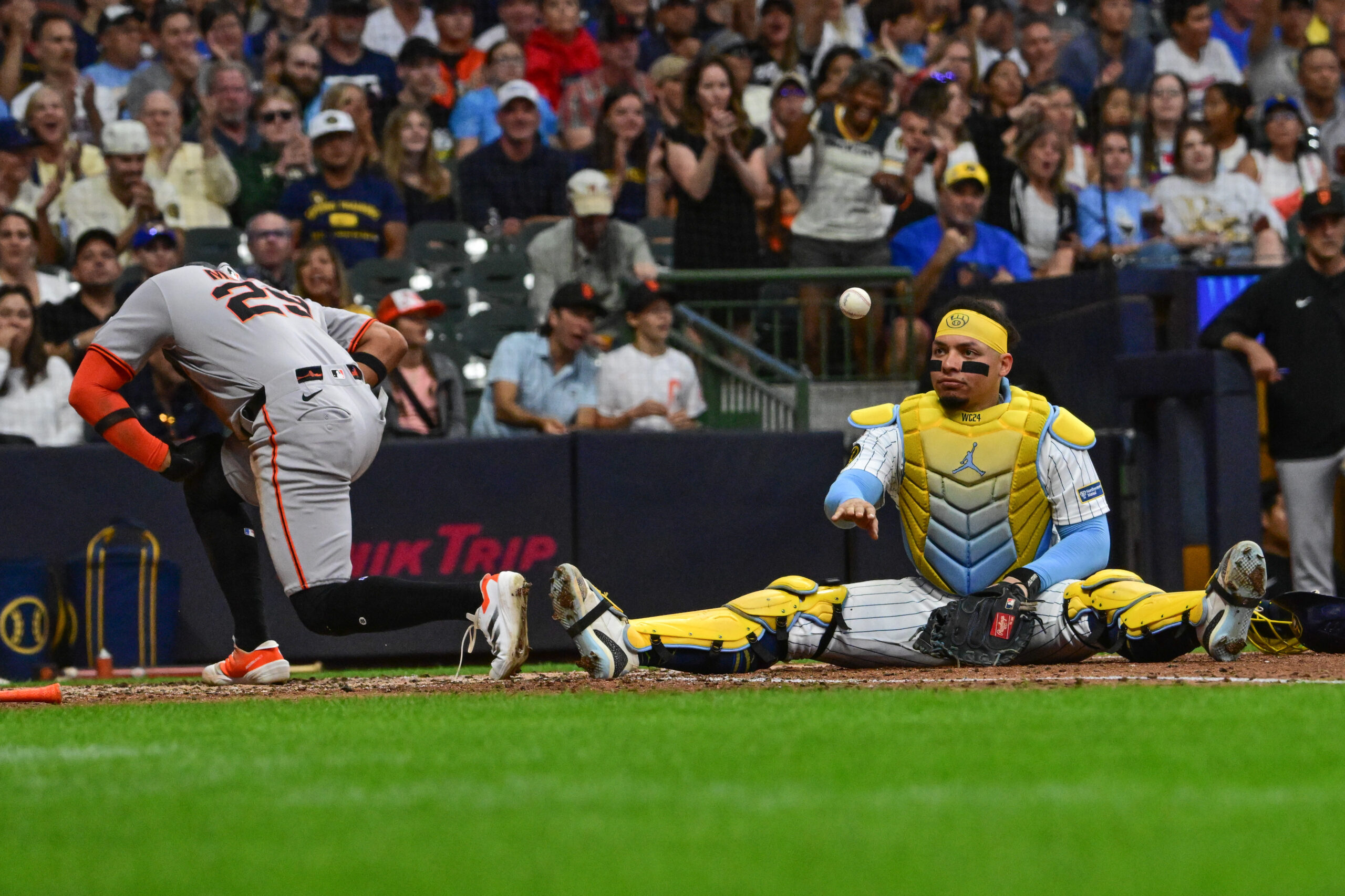 Aug 23, 2025; Milwaukee, Wisconsin, USA; Milwaukee Brewers catcher William Contreras (24) reacts after tagging out San Francisco Giants left fielder Luis Matos (29) trying to score in the sixth inning at American Family Field. Mandatory Credit: Benny Sieu-Imagn Images