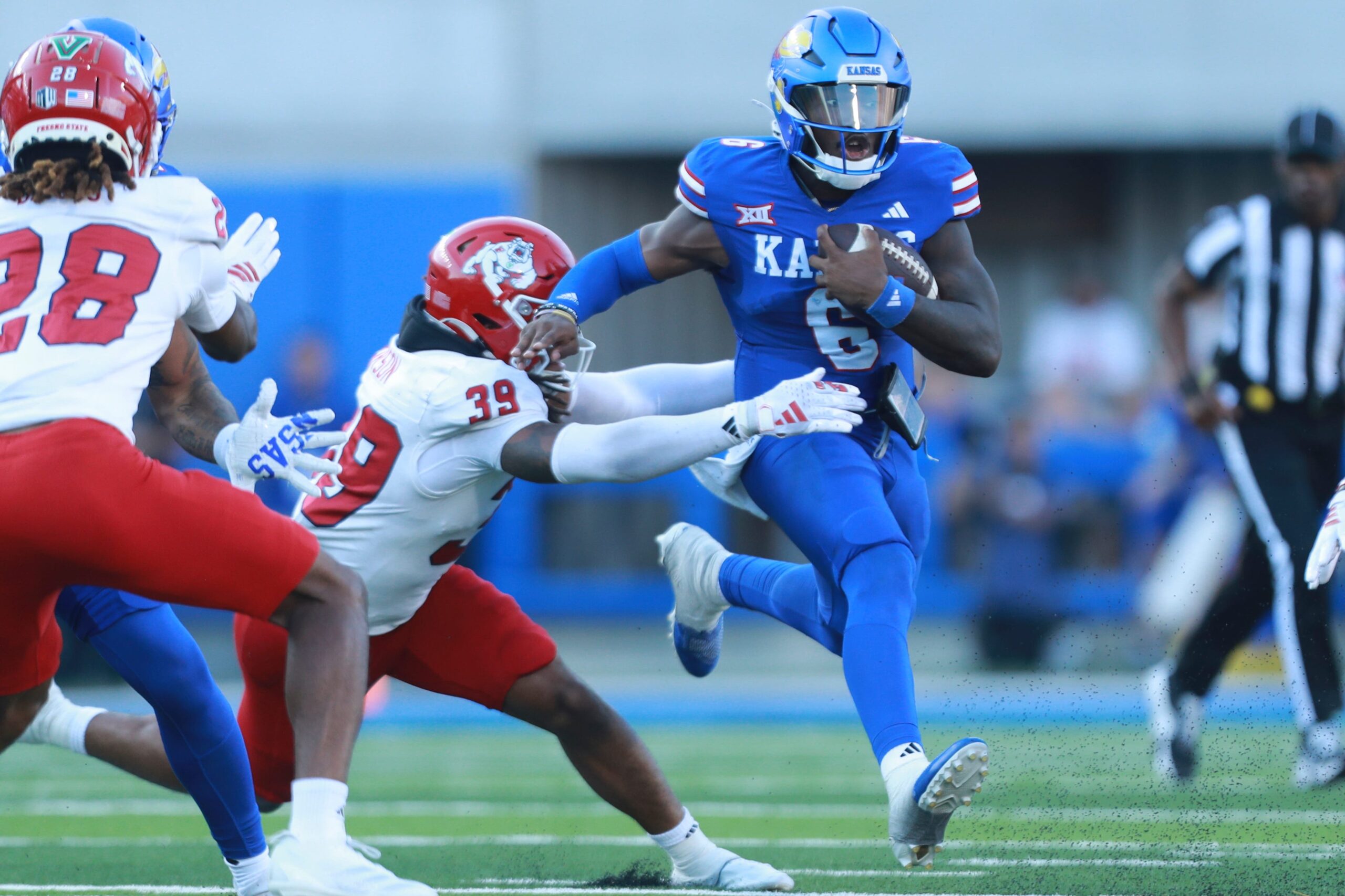 Kansas Jayhawks quarterback Jalon Daniels (6) runs for yards during the game between Fresno State and Kansas at David Booth Kansas Memorial Stadium on Aug. 23, 2025.
