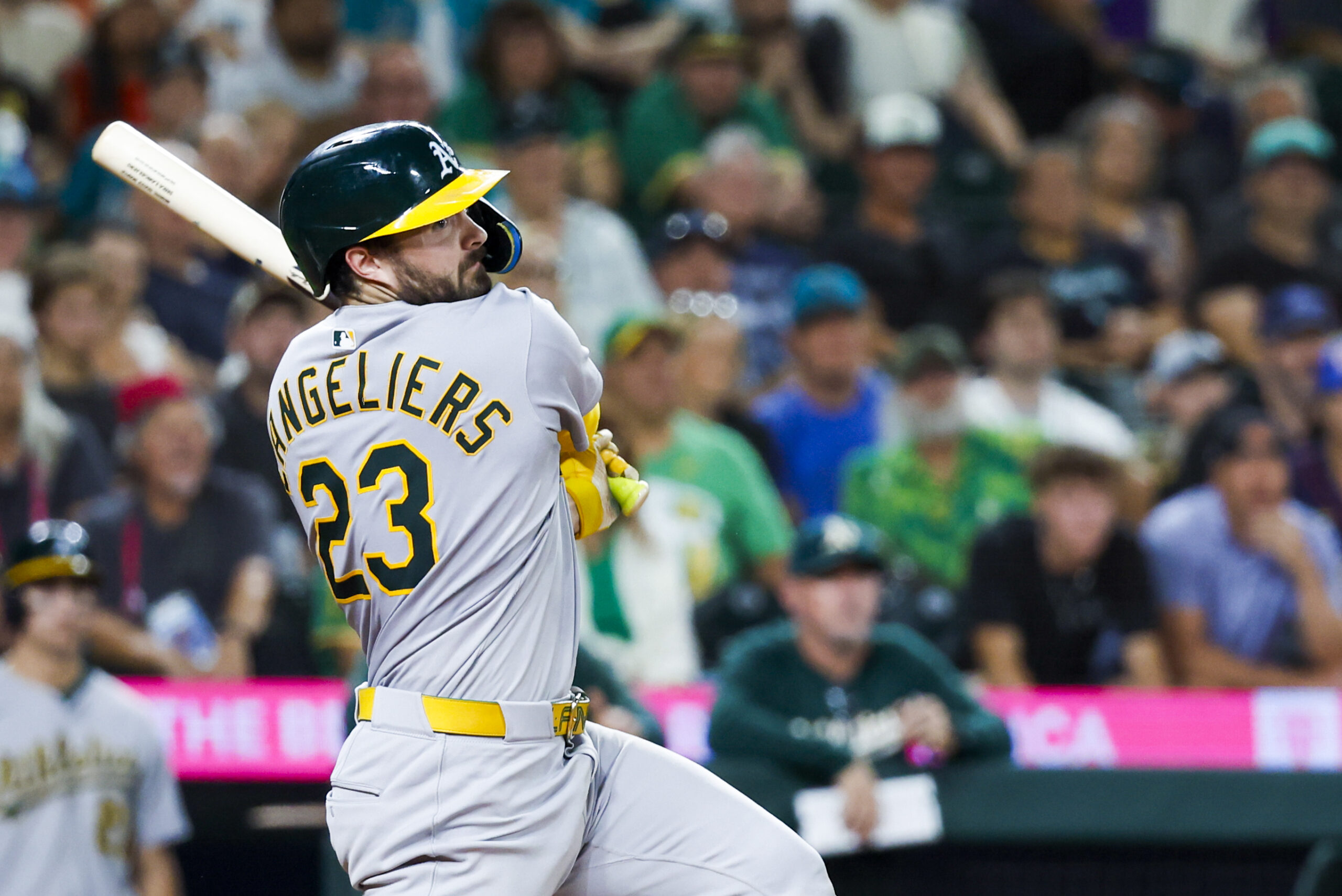 Aug 23, 2025; Seattle, Washington, USA; Athletics catcher Shea Langeliers (23) hits an RBI-double against the Seattle Mariners during the tenth inning at T-Mobile Park. Mandatory Credit: Joe Nicholson-Imagn Images