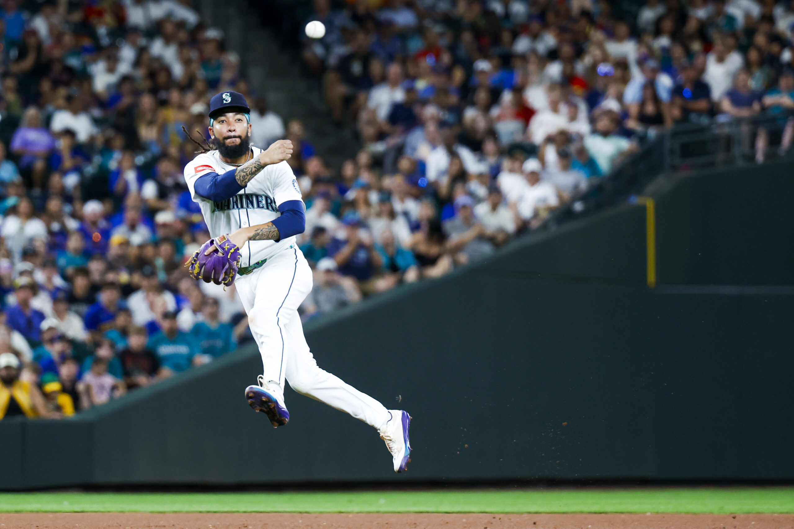 Aug 23, 2025; Seattle, Washington, USA; Seattle Mariners shortstop J.P. Crawford (3) throws to first base for an out against the Athletics during the ninth inning at T-Mobile Park. Mandatory Credit: Joe Nicholson-Imagn Images