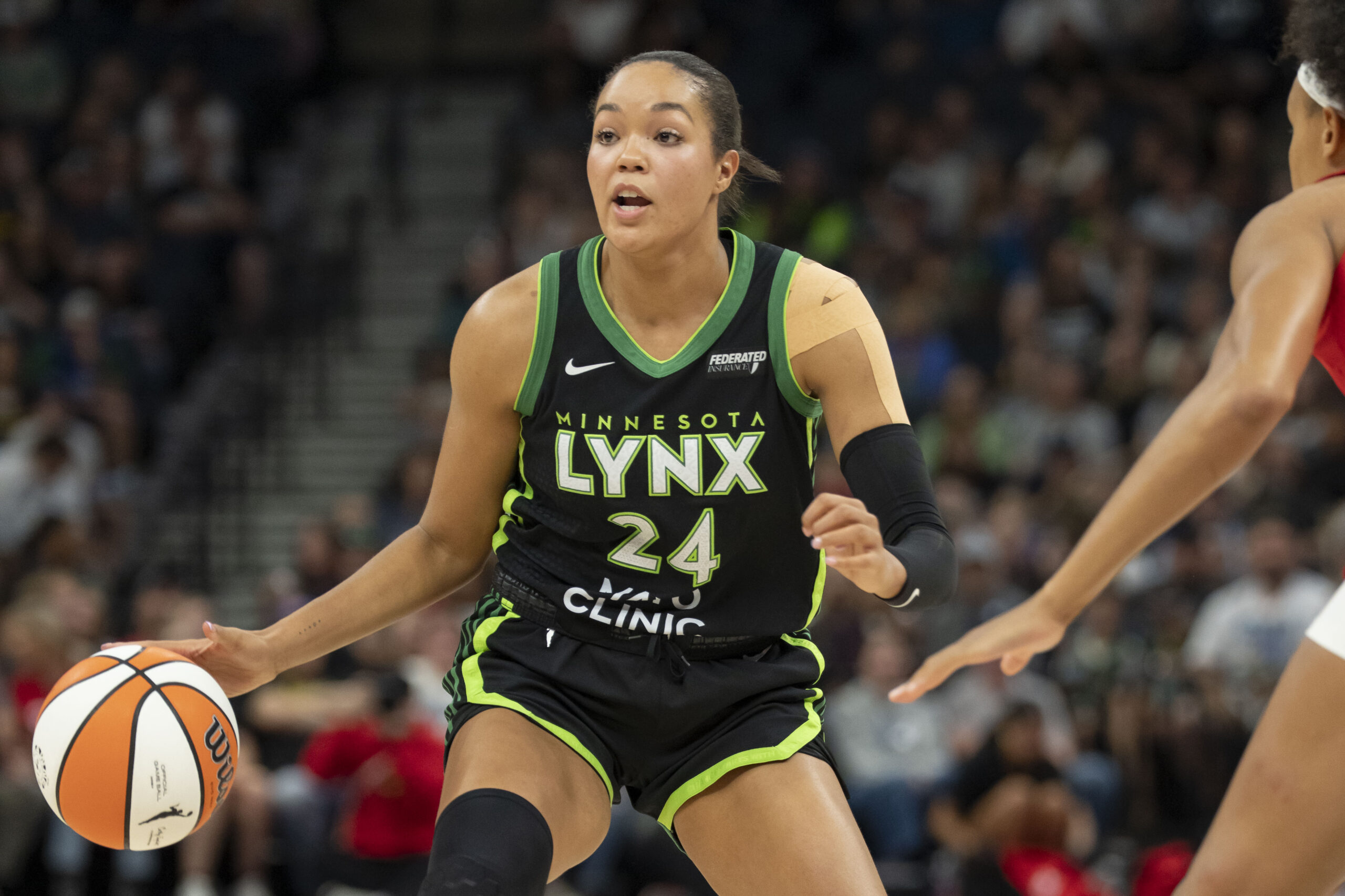 Aug 24, 2025; Minneapolis, Minnesota, USA; Minnesota Lynx forward Napheesa Collier (24) dribbles the ball against the Indiana Fever in the first half at Target Center. Mandatory Credit: Jesse Johnson-Imagn Images