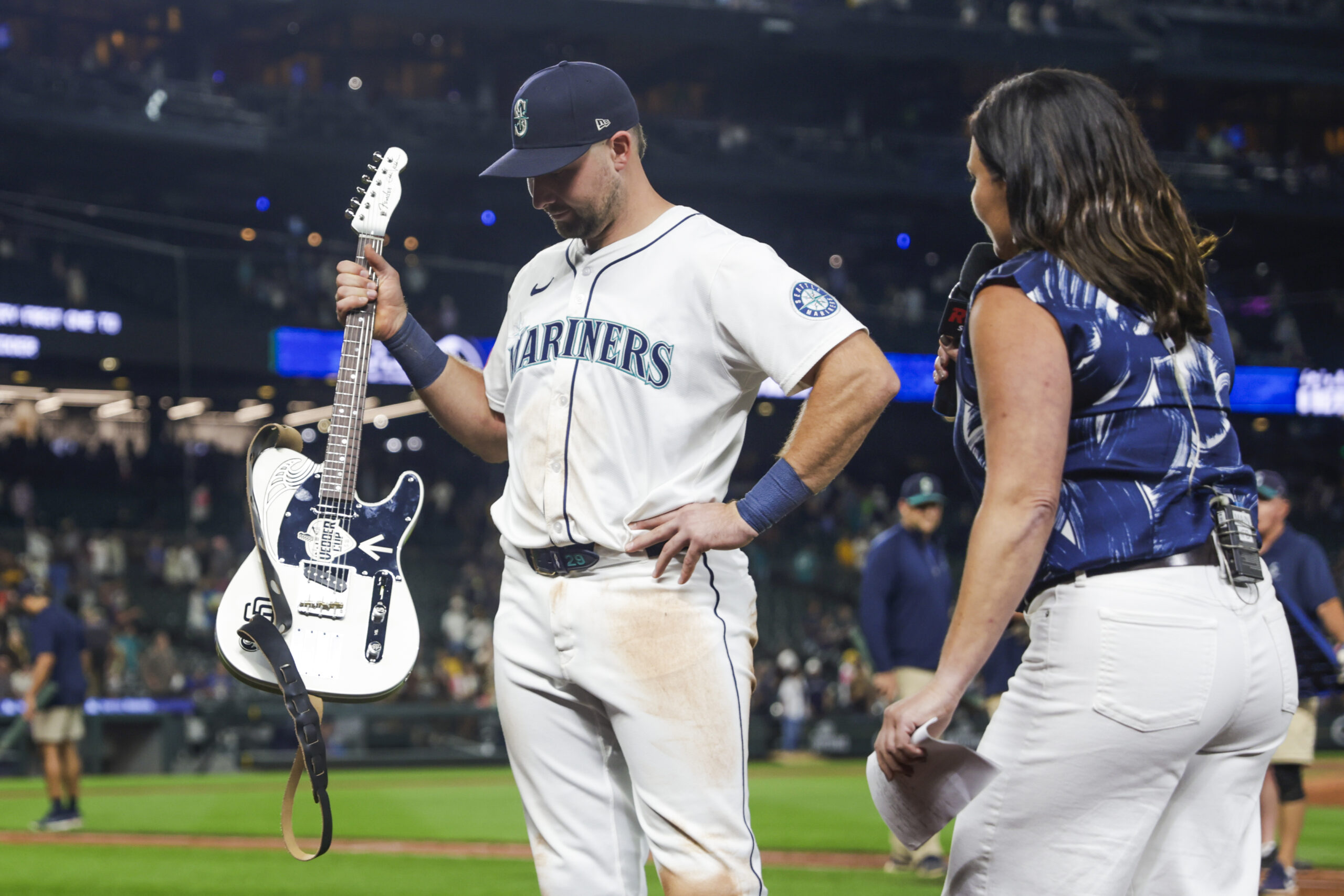Aug 25, 2025; Seattle, Washington, USA; Seattle Mariners catcher Cal Raleigh (29) holds the “Vedder Cup” trophy for the winning the season series against the San Diego Padres following a victory Padres at T-Mobile Park. The “Vedder Cup” is named after Pearl Jam frontman Eddie Vedder. Mandatory Credit: Joe Nicholson-Imagn Images