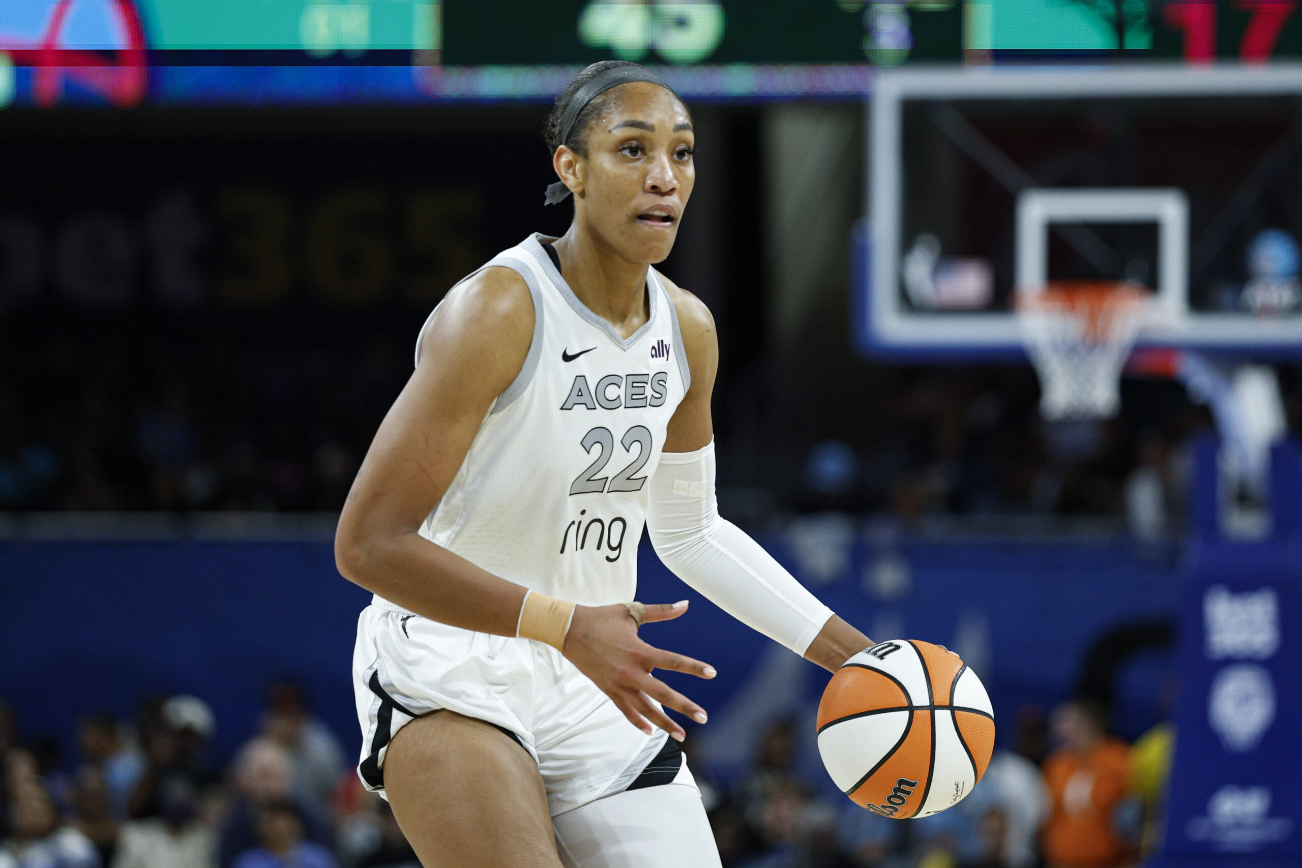 Aug 25, 2025; Chicago, Illinois, USA; Las Vegas Aces center A'ja Wilson (22) brings the ball up court during the second half of a WNBA game against the Chicago Sky at Wintrust Arena. Mandatory Credit: Kamil Krzaczynski-Imagn Images