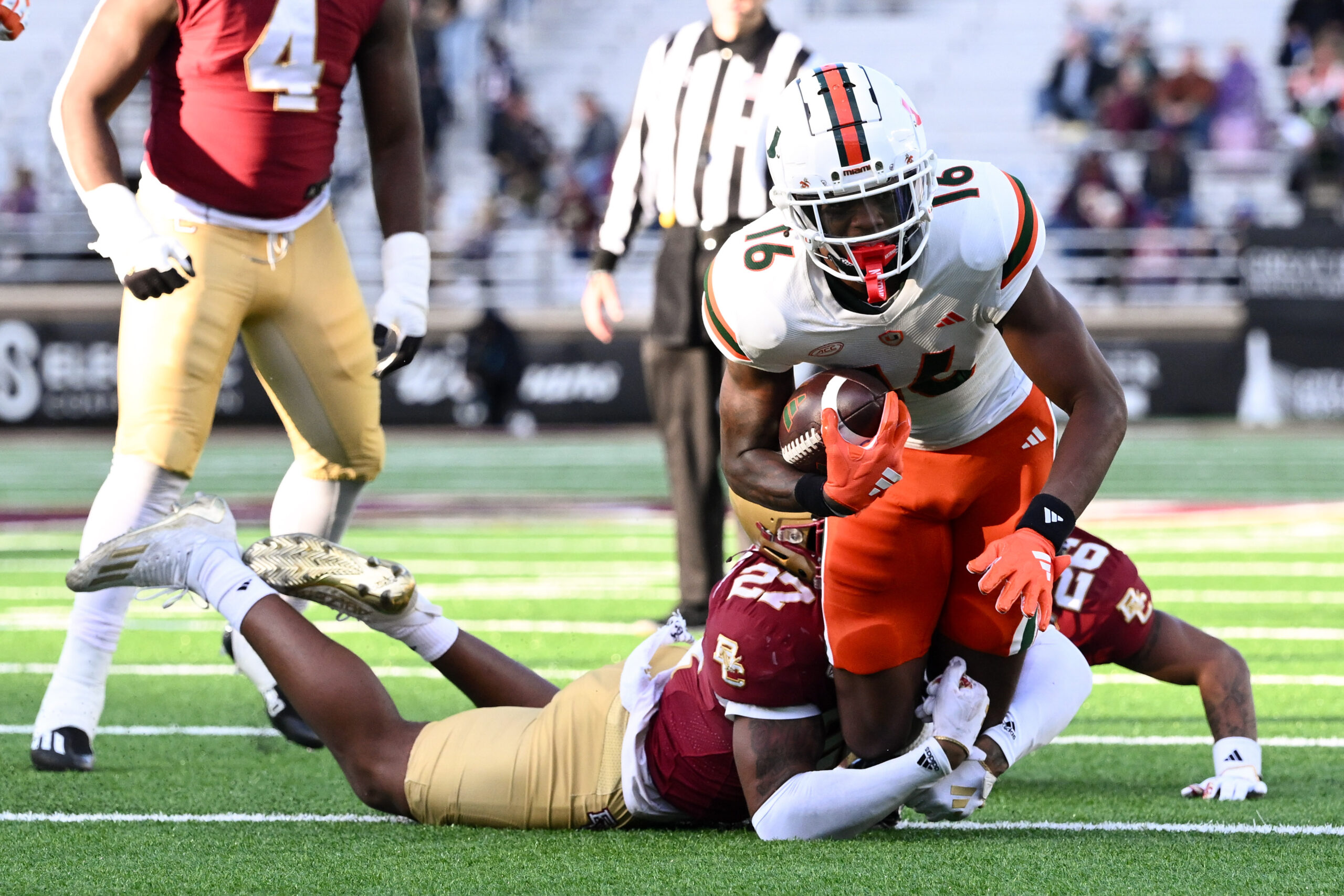 Nov 24, 2023; Chestnut Hill, Massachusetts, USA; Boston College Eagles linebacker Daveon Crouch (27) tackles Miami Hurricanes wide receiver Isaiah Horton (16) during the second half at Alumni Stadium. Mandatory Credit: Brian Fluharty-Imagn Images
