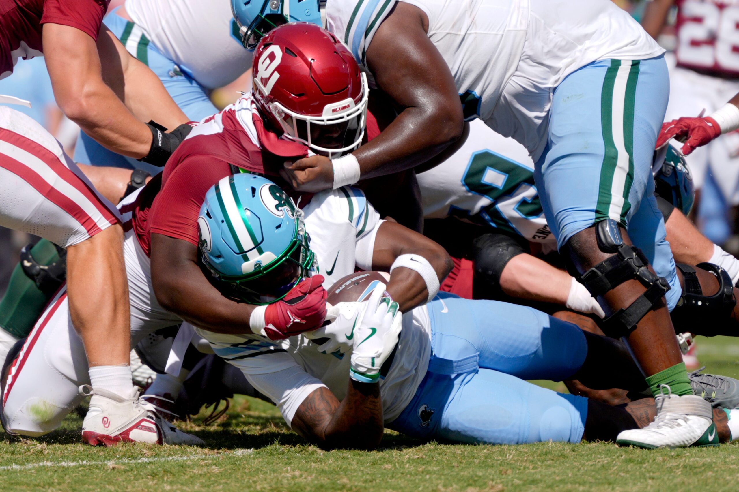 Oklahoma Sooners defensive lineman Da'Jon Terry (95) brings down Tulane Green Wave running back Shaadie Clayton-Johnson (2) during a college football game between the University of Oklahoma Sooners (OU) and the Tulane Green Wave at Gaylord Family - Oklahoma Memorial Stadium in Norman, Okla., Saturday, Sept. 14, 2024.