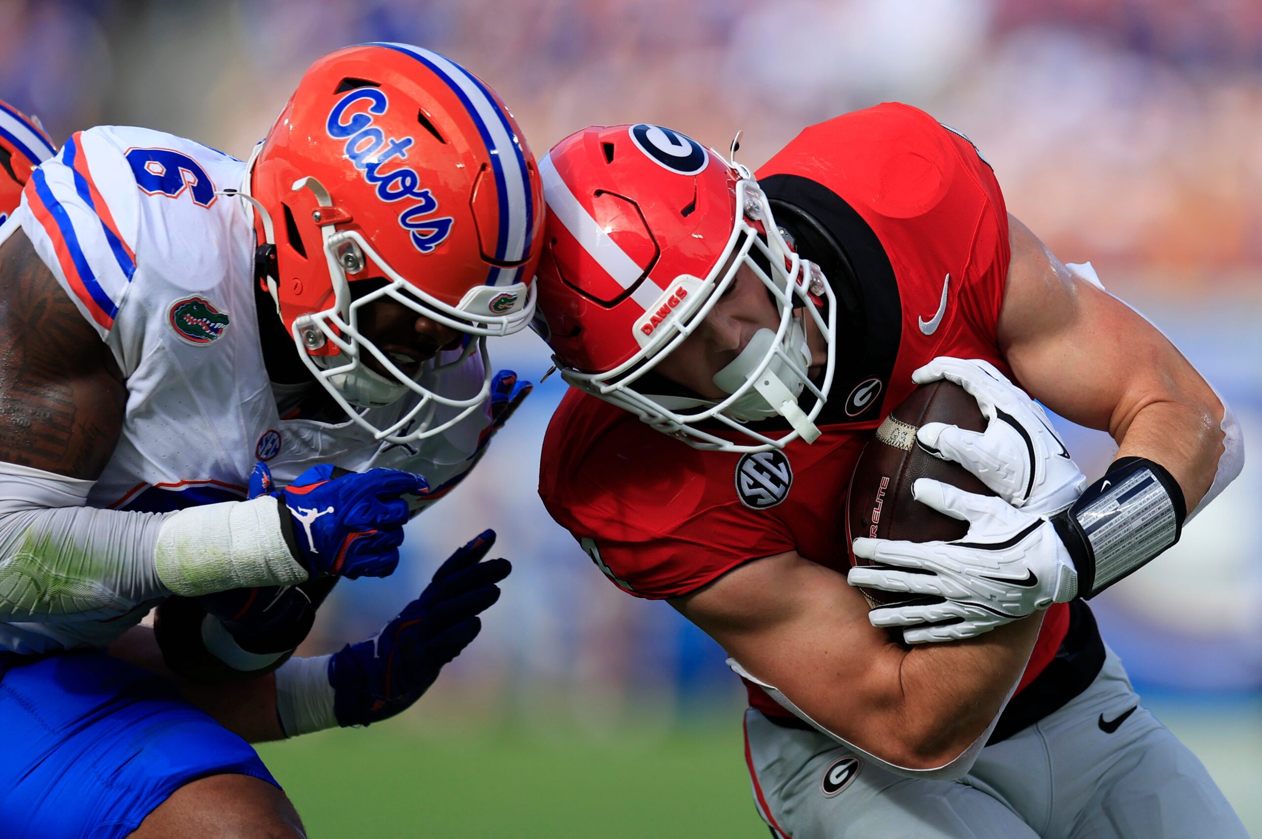 Florida Gators linebacker Shemar James (6) tackles Georgia Bulldogs tight end Oscar Delp (4) during the first quarter of an NCAA college football matchup Saturday, Nov. 2, 2024 at EverBank Stadium in Jacksonville, Fla. The Georgia Bulldogs defeated the Florida Gators 34-20. [Corey Perrine/Florida Times-Union]