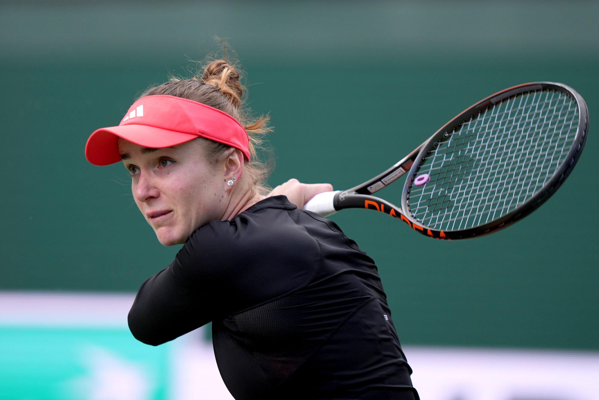 Elina Svitolina follows through on a return to Mirra Andreeva in their quarterfinal match on Stadium 2 at the BNP Paribas Open in Indian Wells, Calif., on Thurs., March 13, 2025.