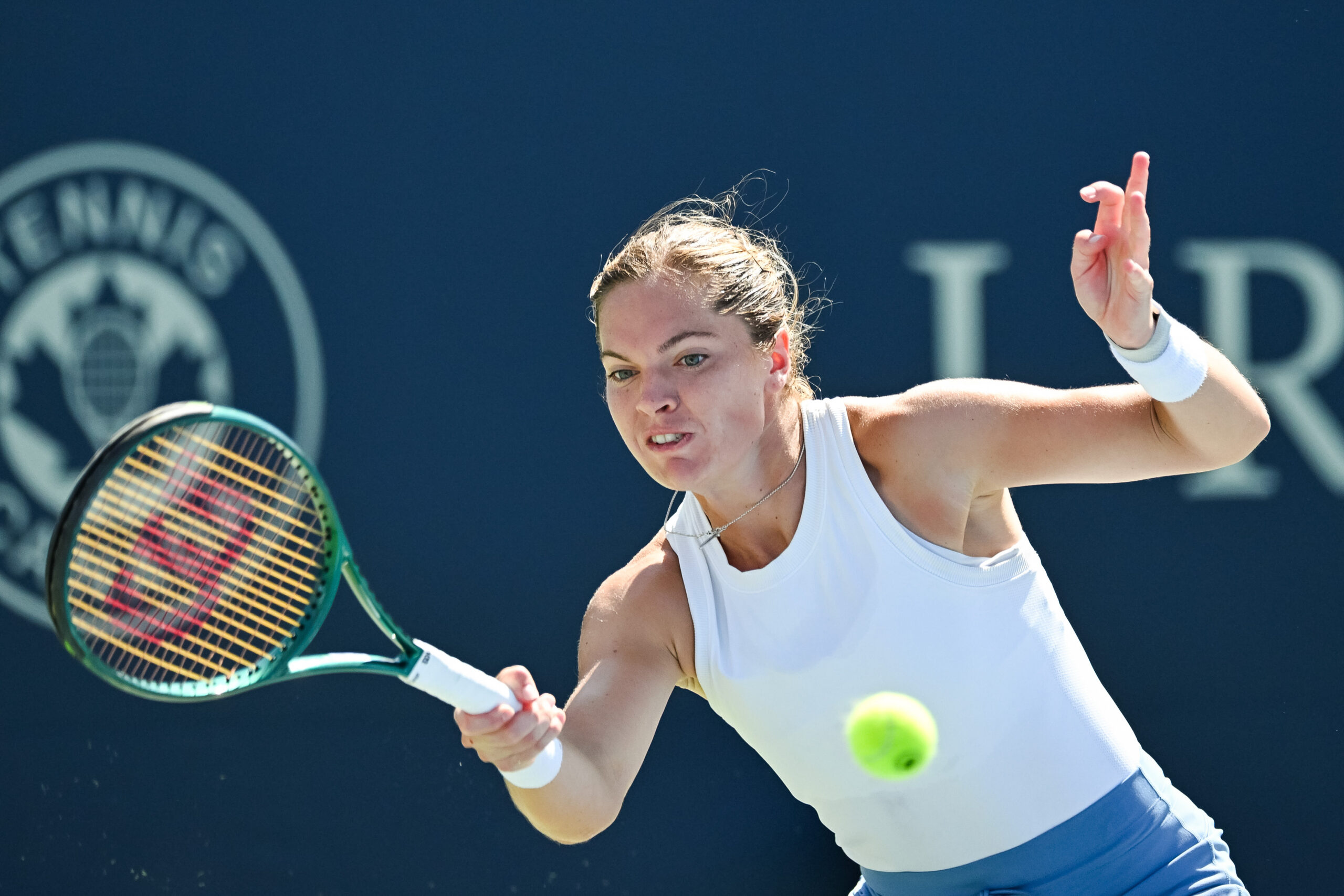 Aug 1, 2025; Montreal, QC, Canada; Caty Mcnally (USA) returns the ball to Madison Keys (USA) in third round play at IGA Stadium. Mandatory Credit: David Kirouac-Imagn Images