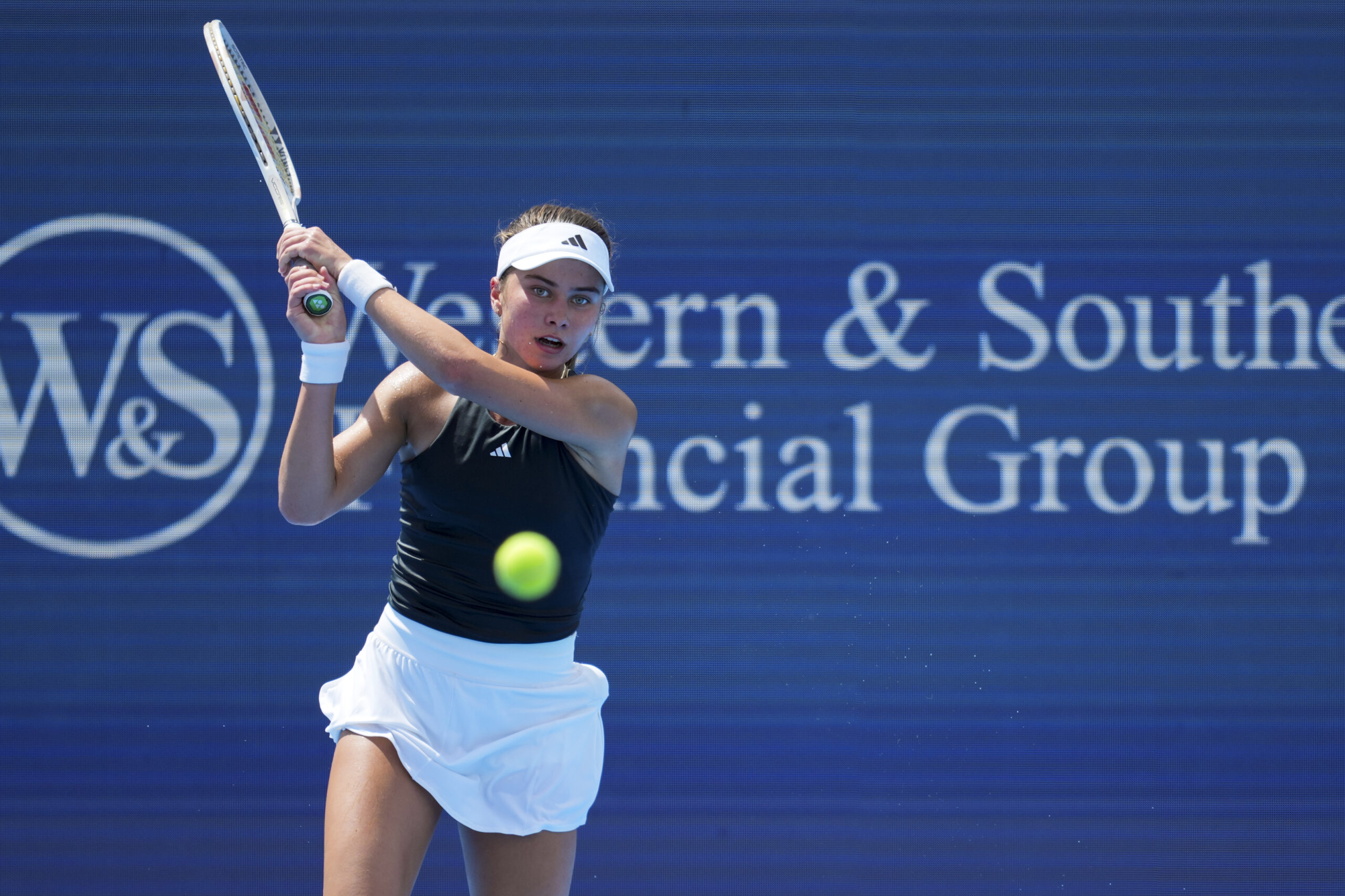 Aug 12, 2025; Cincinnati, OH, USA; Iva Jovic (USA) returns a shot against Barbora Krejcikova (CZE) during the Cincinnati Open at the Lindner Family Tennis Center. Mandatory Credit: Aaron Doster-Imagn Images
