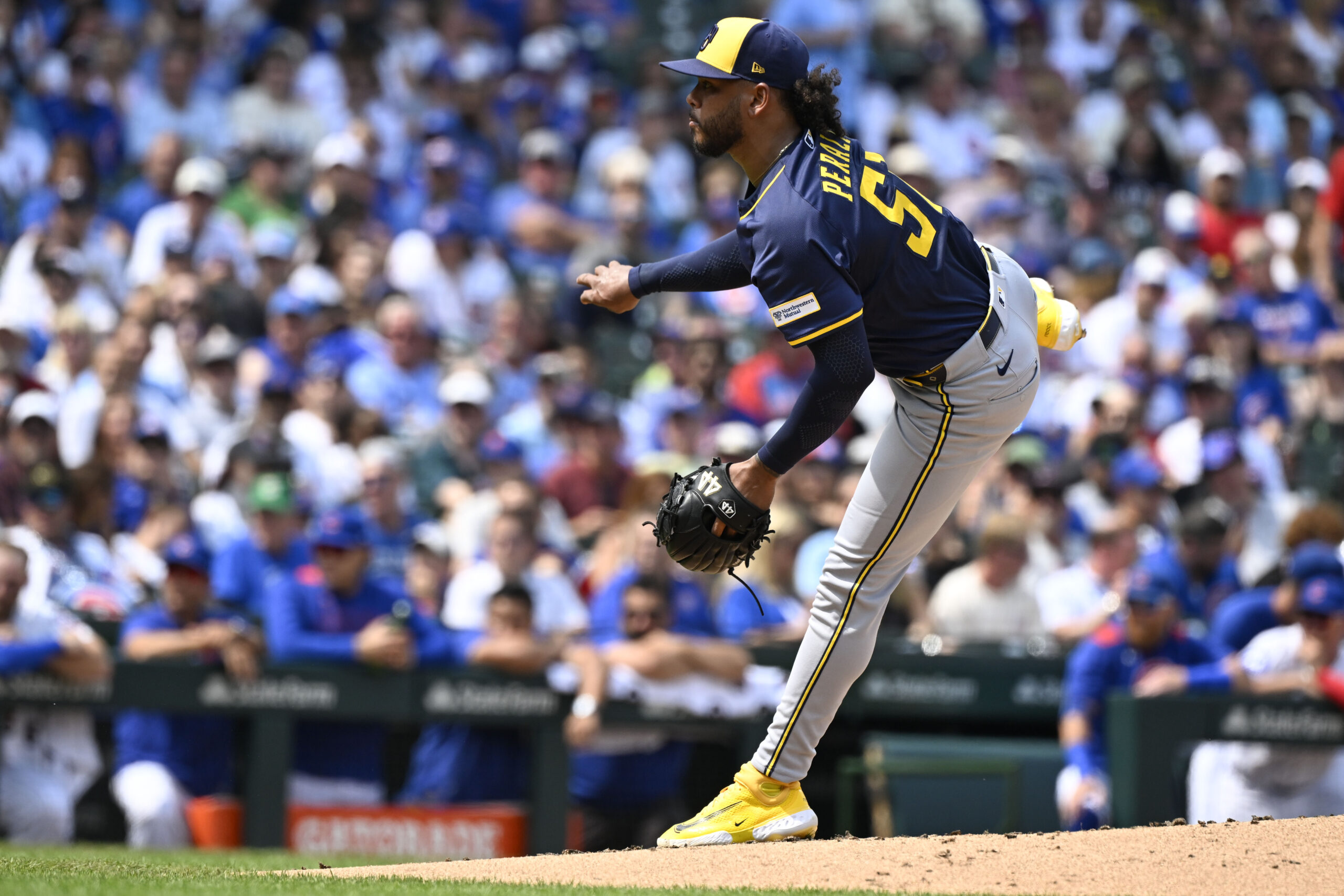 Aug 18, 2025; Chicago, Illinois, USA; Milwaukee Brewers pitcher Freddy Peralta (51) delivers during the second inning against the Chicago Cubs at Wrigley Field. Mandatory Credit: Matt Marton-Imagn Images