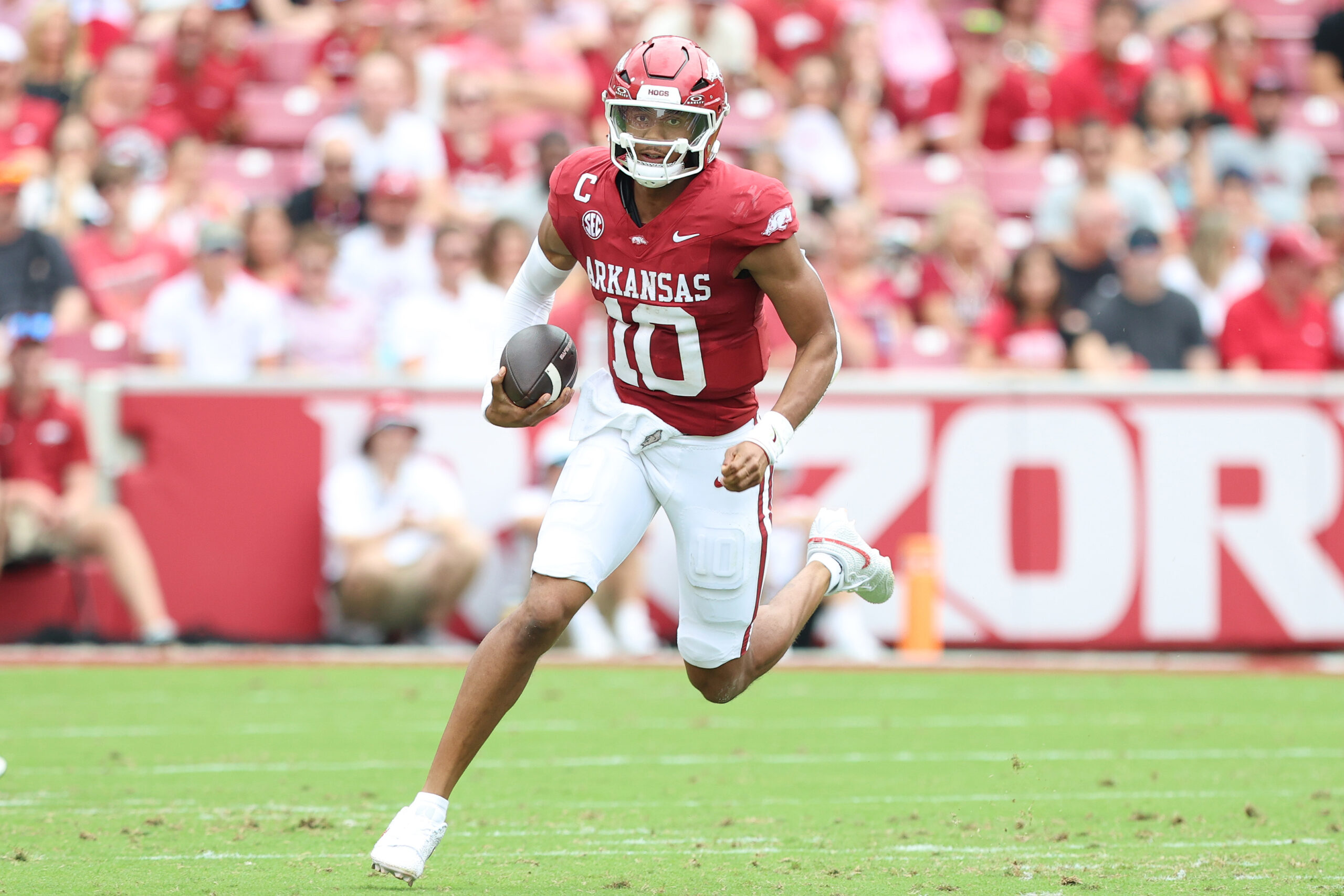 Aug 30, 2025; Fayetteville, Arkansas, USA; Arkansas Razorbacks quarterback Taylen Green (10) rushes during the first quarter against the Alabama A&M Bulldogs at Donald W. Reynolds Razorback Stadium. Mandatory Credit: Nelson Chenault-Imagn Images