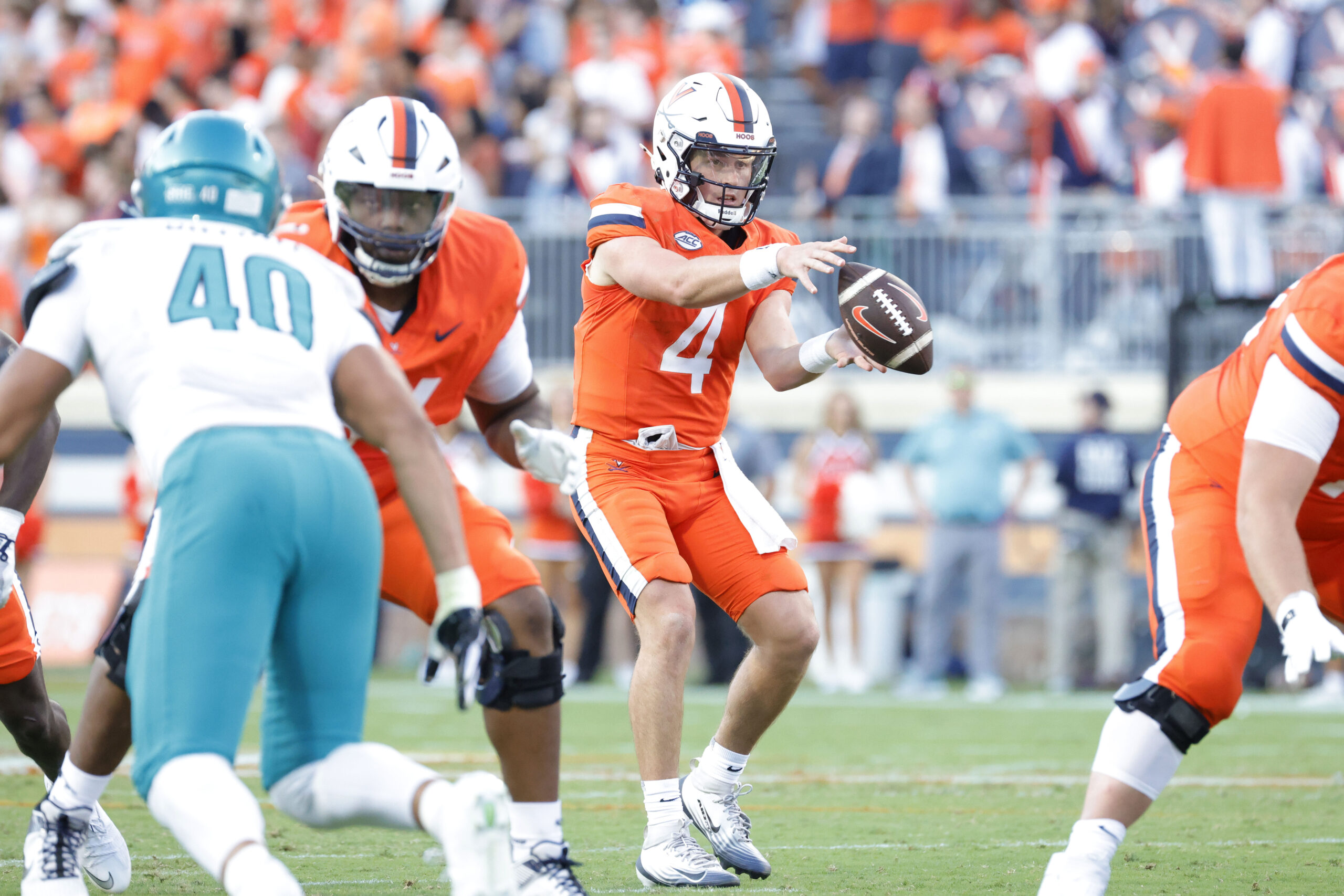 Aug 30, 2025; Charlottesville, Virginia, USA; Virginia Cavaliers quarterback Chandler Morris (4) catches a snap against the Coastal Carolina Chanticleers during the second quarter at Scott Stadium. Mandatory Credit: Amber Searls-Imagn Images