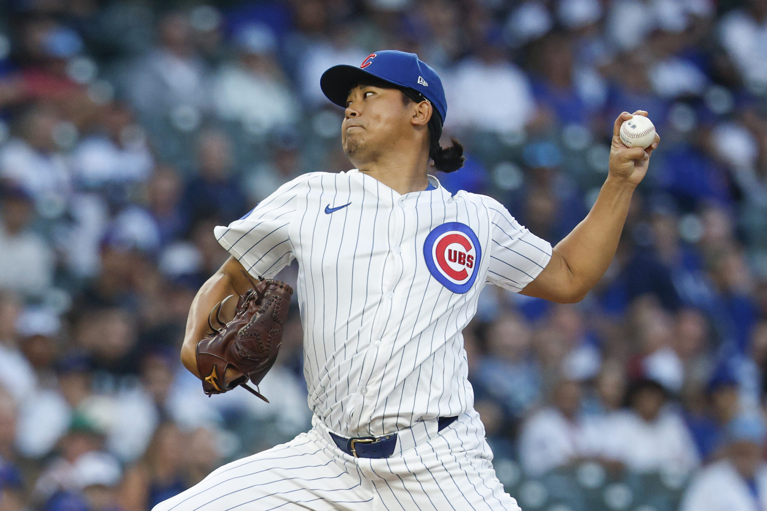 Sep 5, 2025; Chicago, Illinois, USA; Chicago Cubs starting pitcher Shota Imanaga (18) delivers a pitch against the Atlanta Braves during the first inning at Wrigley Field. Mandatory Credit: Kamil Krzaczynski-Imagn Images
