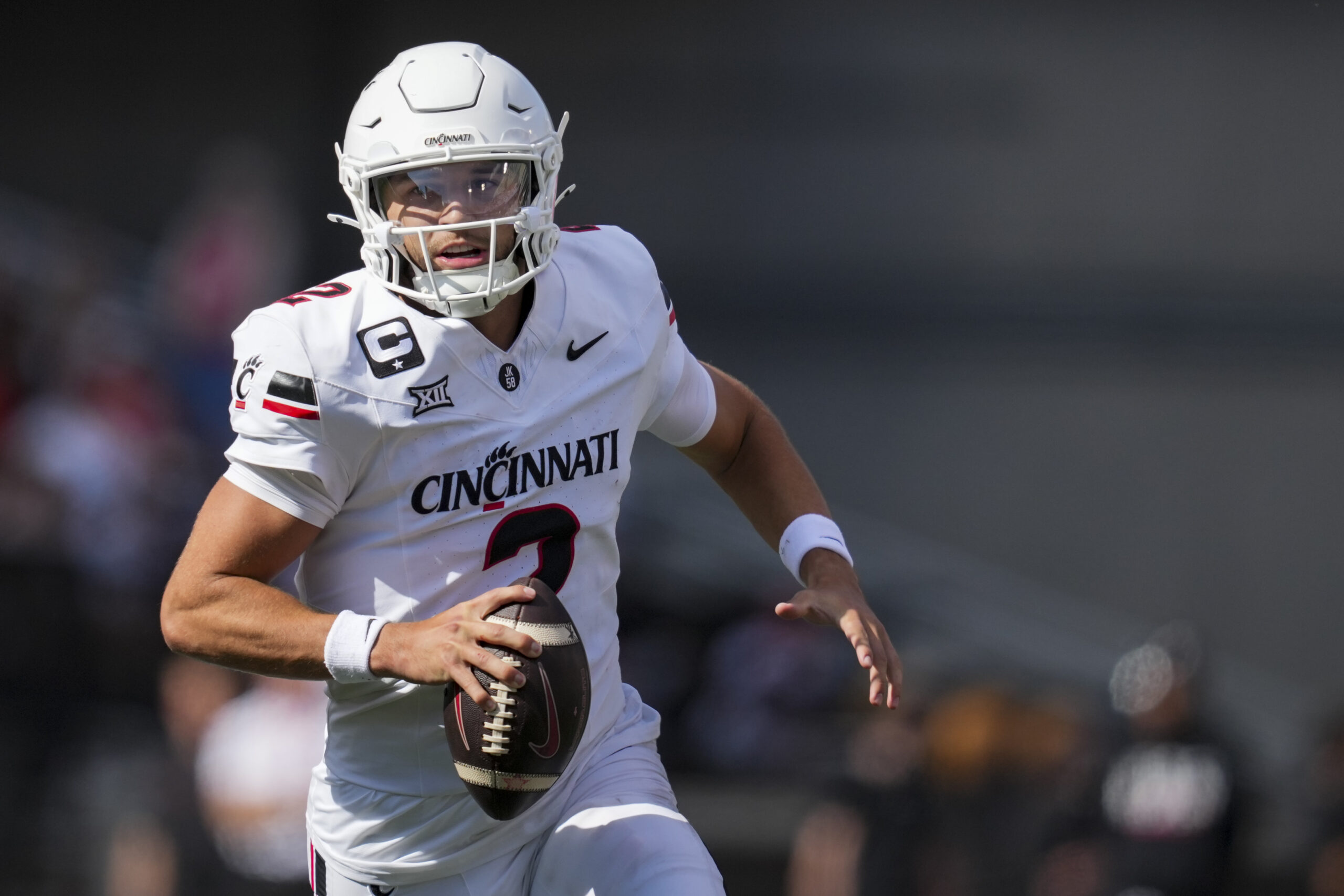 Sep 6, 2025; Cincinnati, Ohio, USA; Cincinnati Bearcats quarterback Brendan Sorsby (2) runs with the ball as he looks to pass against the Bowling Green Falcons in the first half at Nippert Stadium. Mandatory Credit: Aaron Doster-Imagn Images