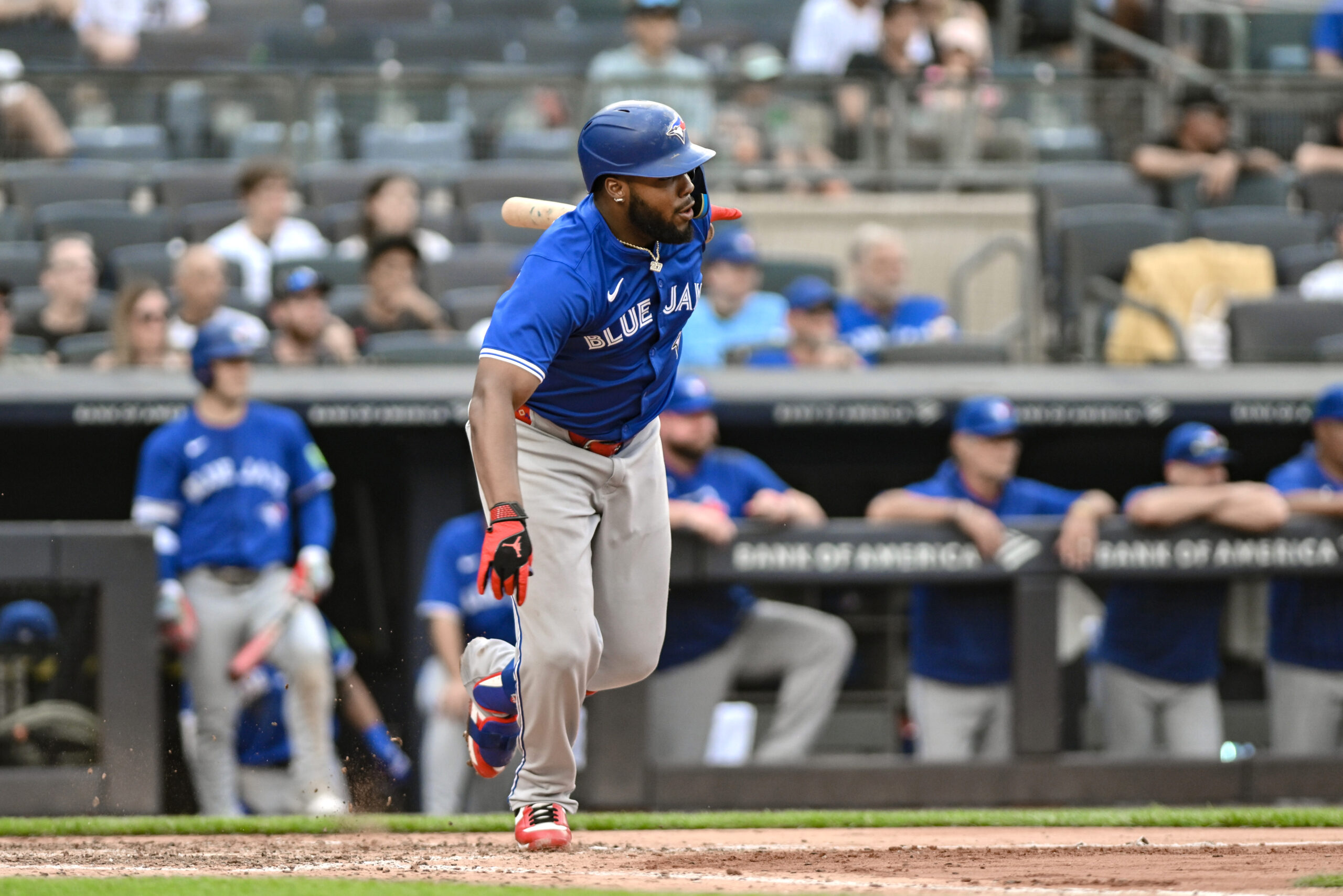 Sep 6, 2025; Bronx, New York, USA; Toronto Blue Jays first baseman Vladimir Guerrero Jr. (27) hits an infield single against the New York Yankees during the eighth inning at Yankee Stadium. Mandatory Credit: John Jones-Imagn Images