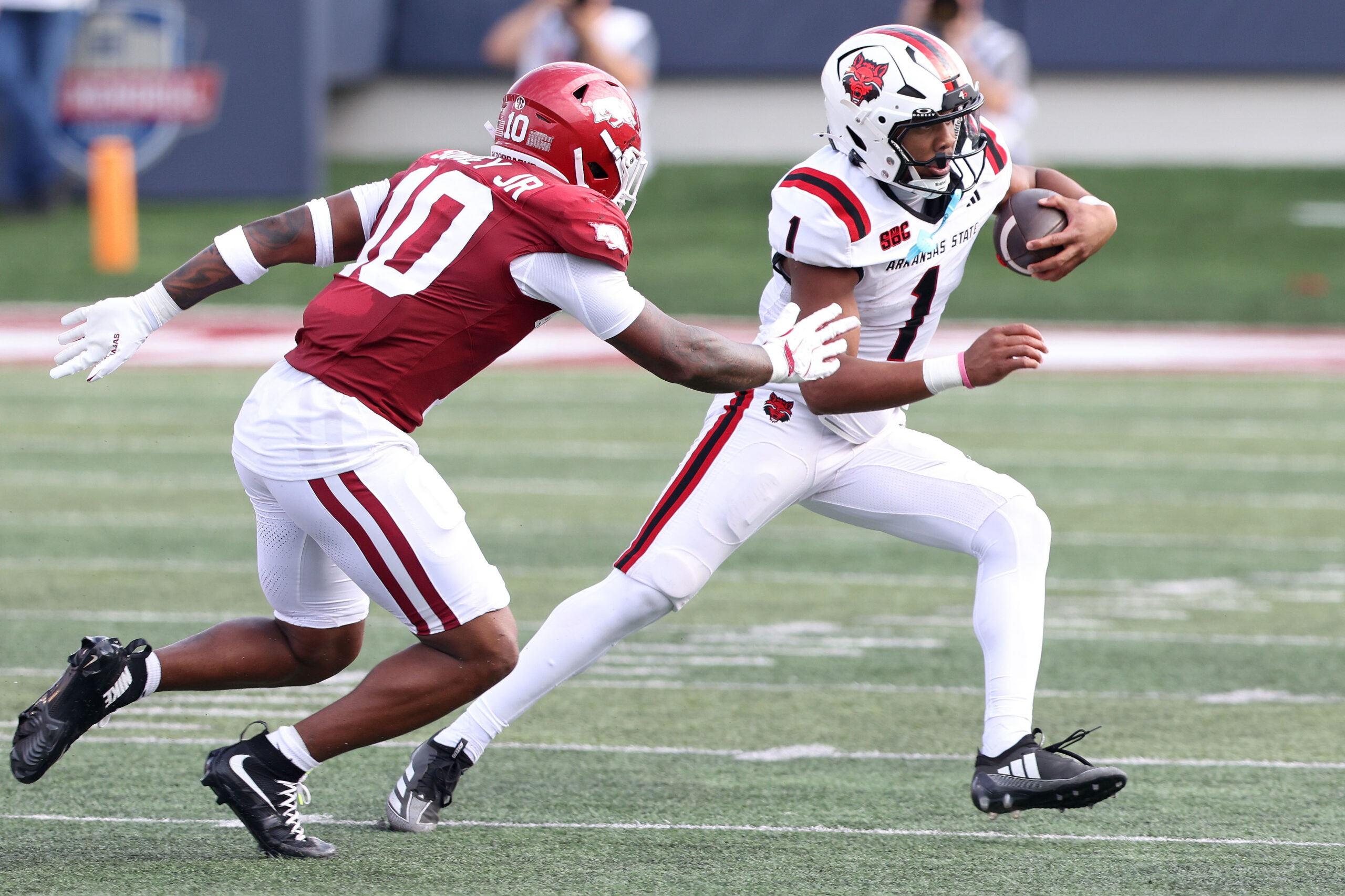 Sep 6, 2025; Little Rock, Arkansas, USA; Arkansas State Red Wolves quarterback Jaylen Raynor (1) rushes during the first quarter against the Arkansas Razorbacks at War Memorial Stadium. Mandatory Credit: Nelson Chenault-Imagn Images