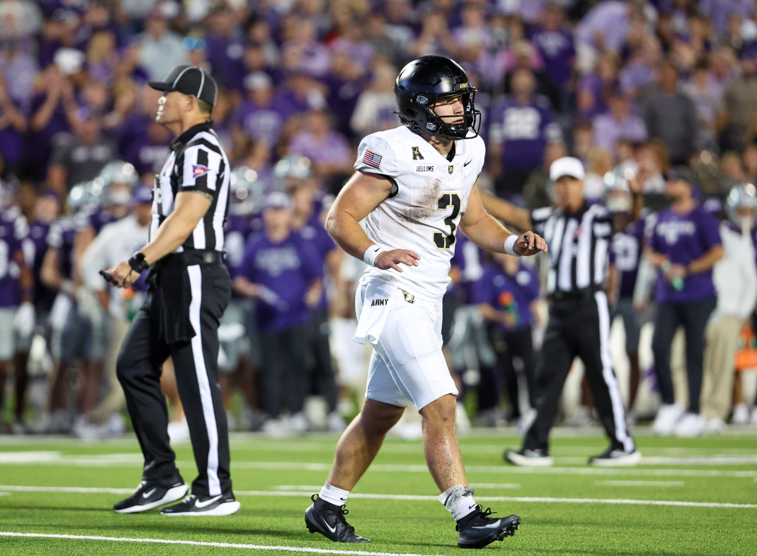 Sep 6, 2025; Manhattan, Kansas, USA; Army Black Knights quarterback Cale Hellums (3) limps to the sideline after scoring a touchdown in the third quarter against the Kansas State Wildcats at Bill Snyder Family Football Stadium. Mandatory Credit: Scott Sewell-Imagn Images
