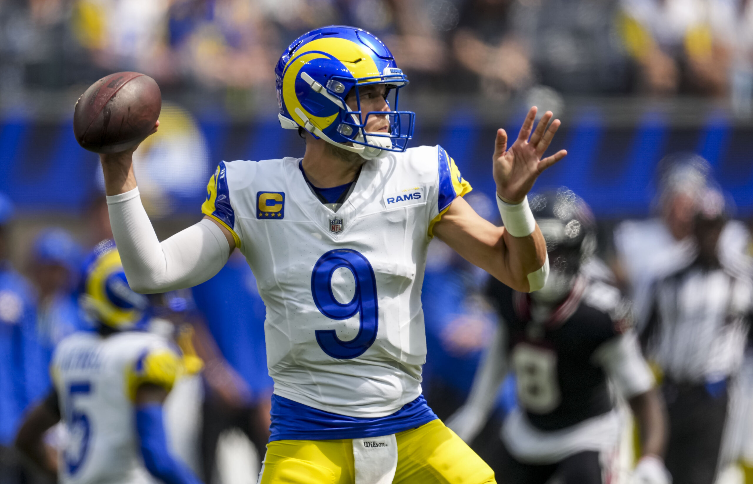 Sep 7, 2025; Inglewood, California, USA; Los Angeles Rams quarterback Matthew Stafford (9) attempts a pass during the first quarter at SoFi Stadium. Mandatory Credit: Kirby Lee-Imagn Images