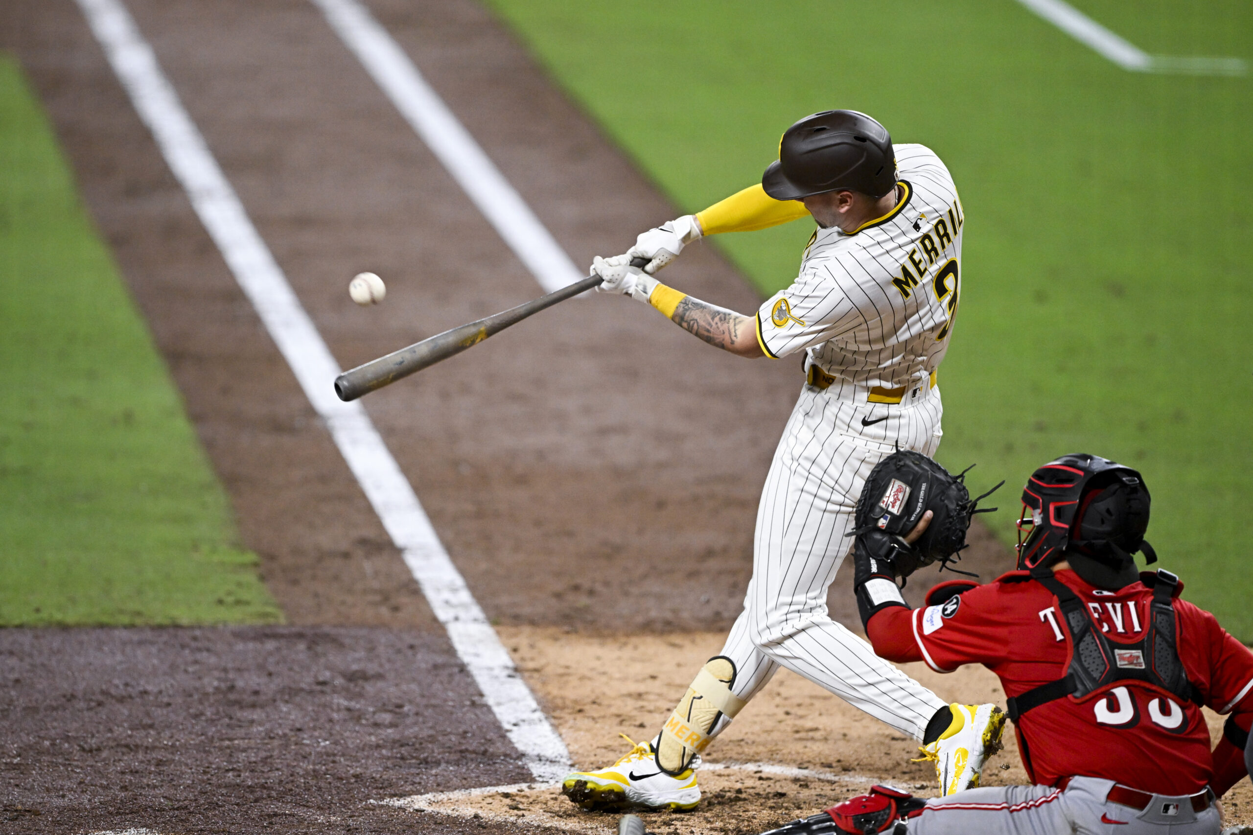 Sep 8, 2025; San Diego, California, USA; San Diego Padres center fielder Jackson Merrill (3) hits an RBI triple during the sixth inning against the Cincinnati Reds at Petco Park. Mandatory Credit: Denis Poroy-Imagn Images