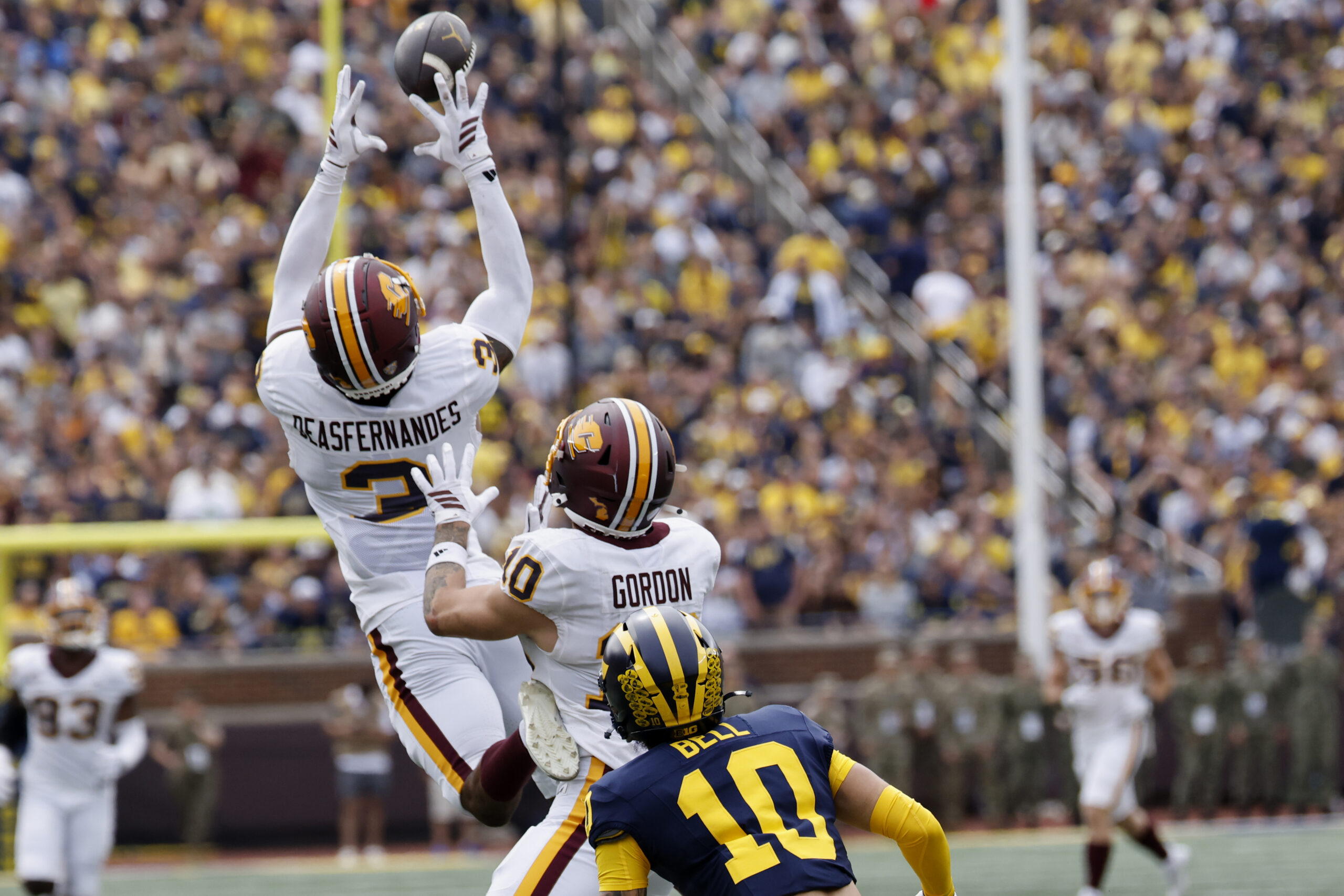 Sep 13, 2025; Ann Arbor, Michigan, USA;  Central Michigan Chippewas defensive back Brenden Deasfernandes (3) makes an interception in the first half against the Michigan Wolverines at Michigan Stadium. Mandatory Credit: Rick Osentoski-Imagn Images